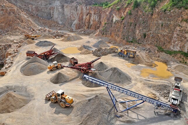 Mining site with heavy machinery.