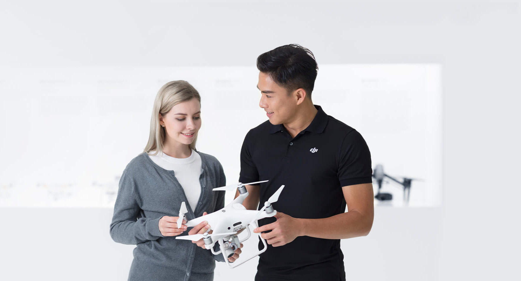 A display of various drones for sale in a modern store.