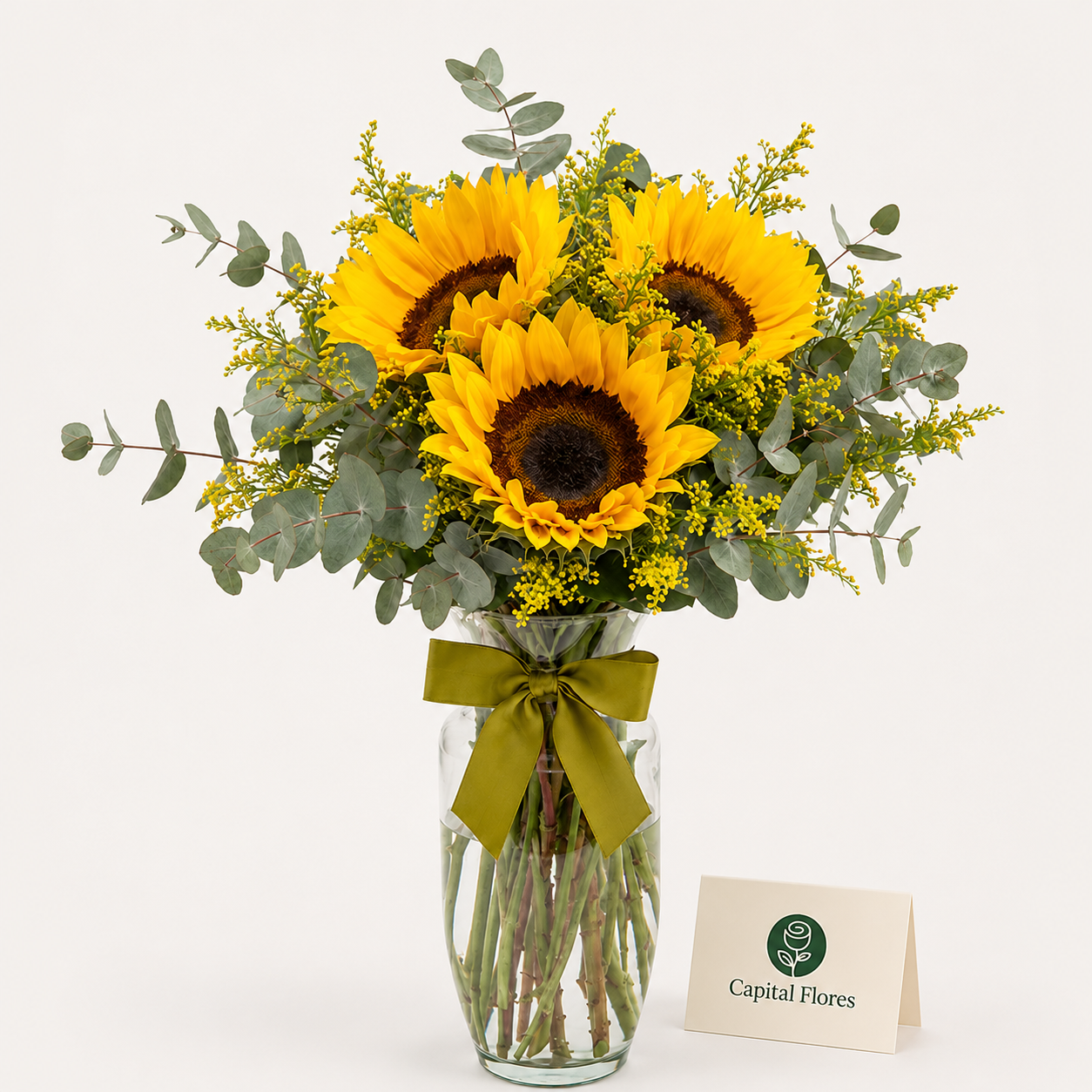 Girasoles y eucalipto en florero Girasoles y eucalipto en florero - Capital Flores with same-day home delivery