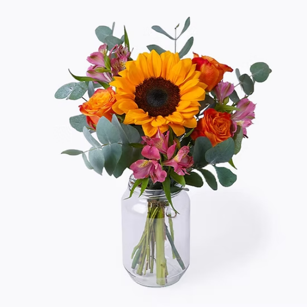 Sunflower and orange roses in a vase - Capital Flores with same-day home delivery