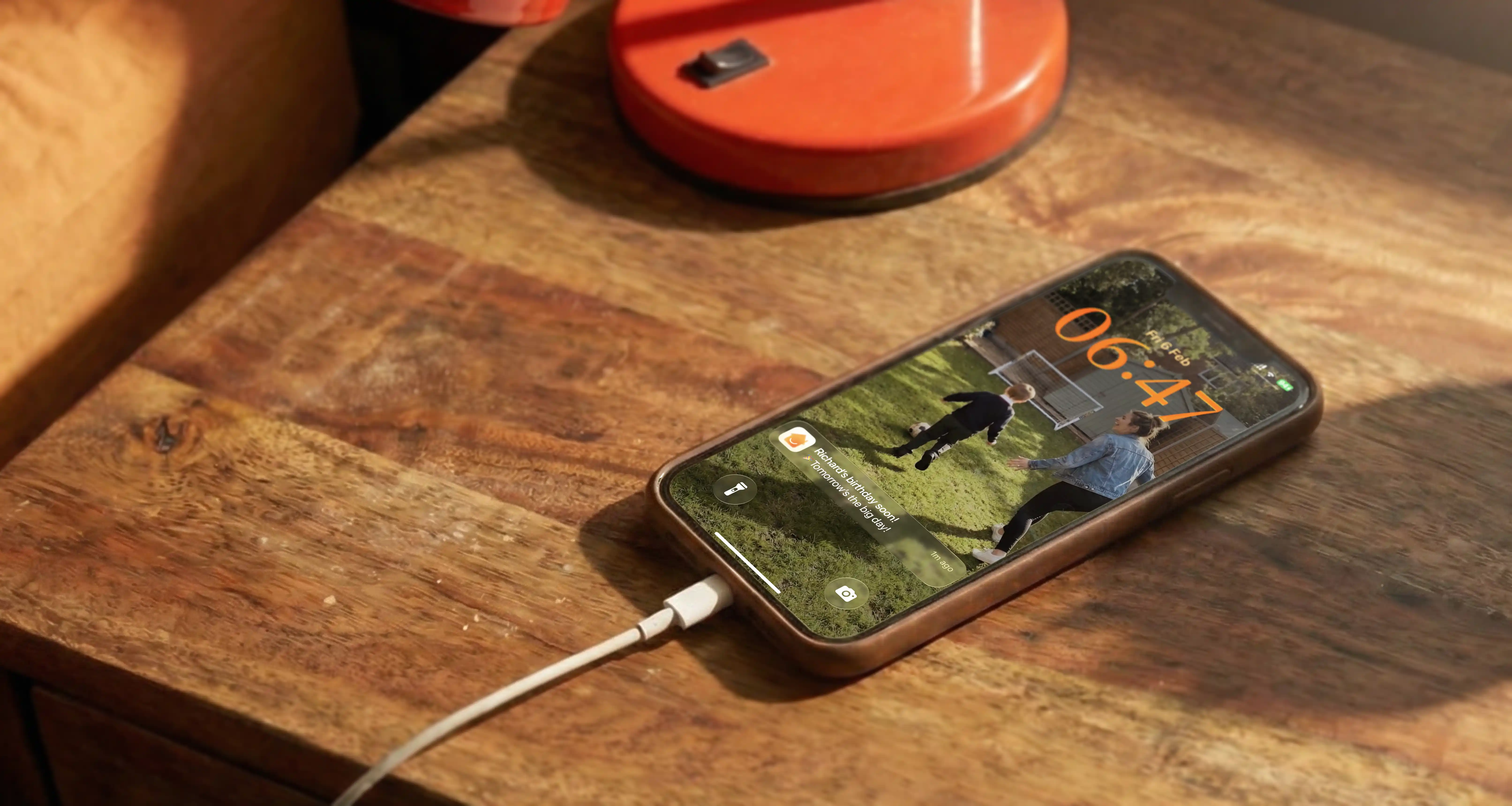 A calming image showing a preview of the HomeOS app interface on a phone.