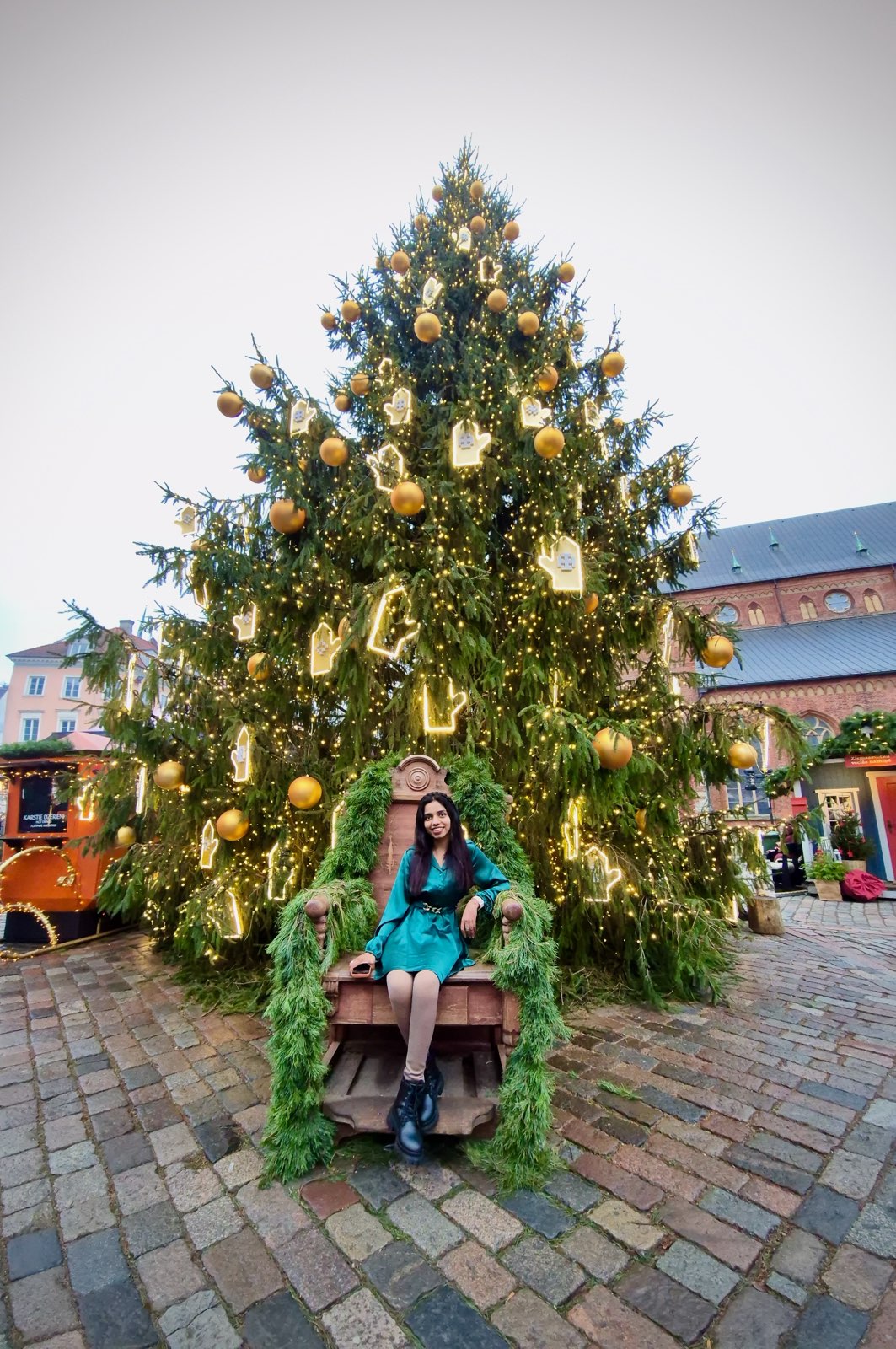 A city street with trams and historic buildings.