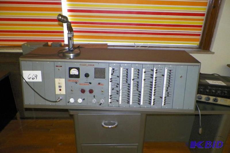 A school reception desk, implying announcements and public address.