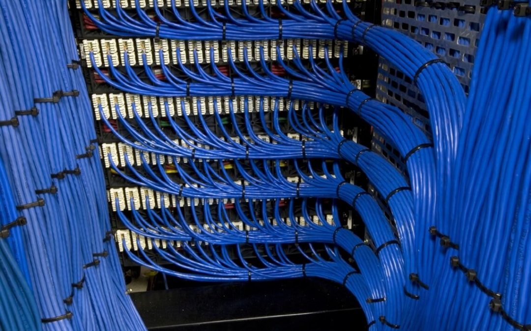 A server room with neatly organized network cables connected to switches.