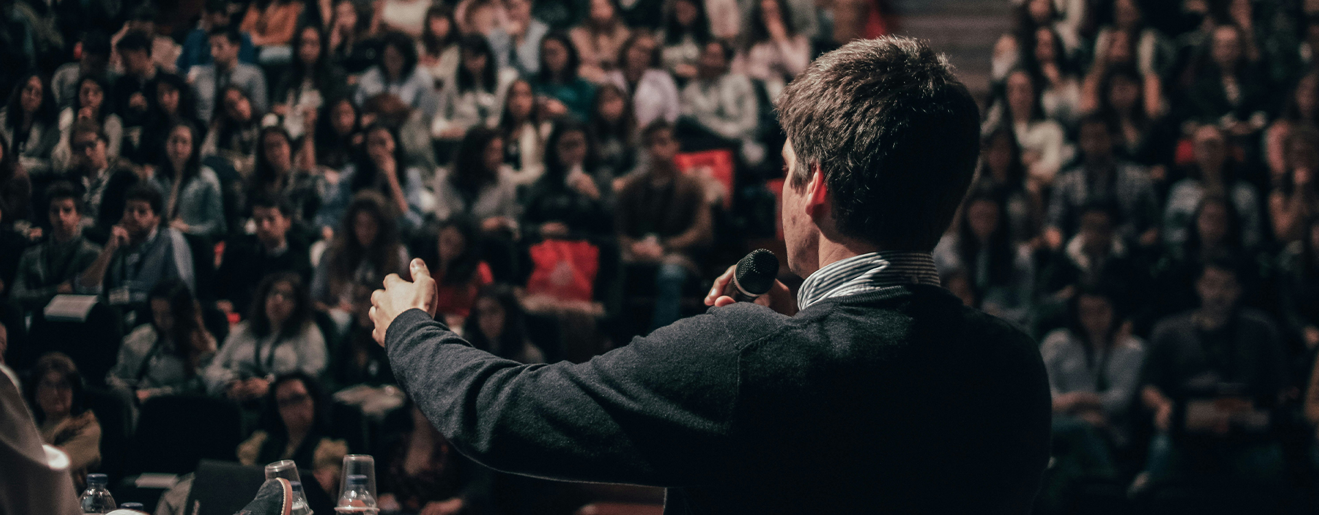 A pastor speaking to the congregation.