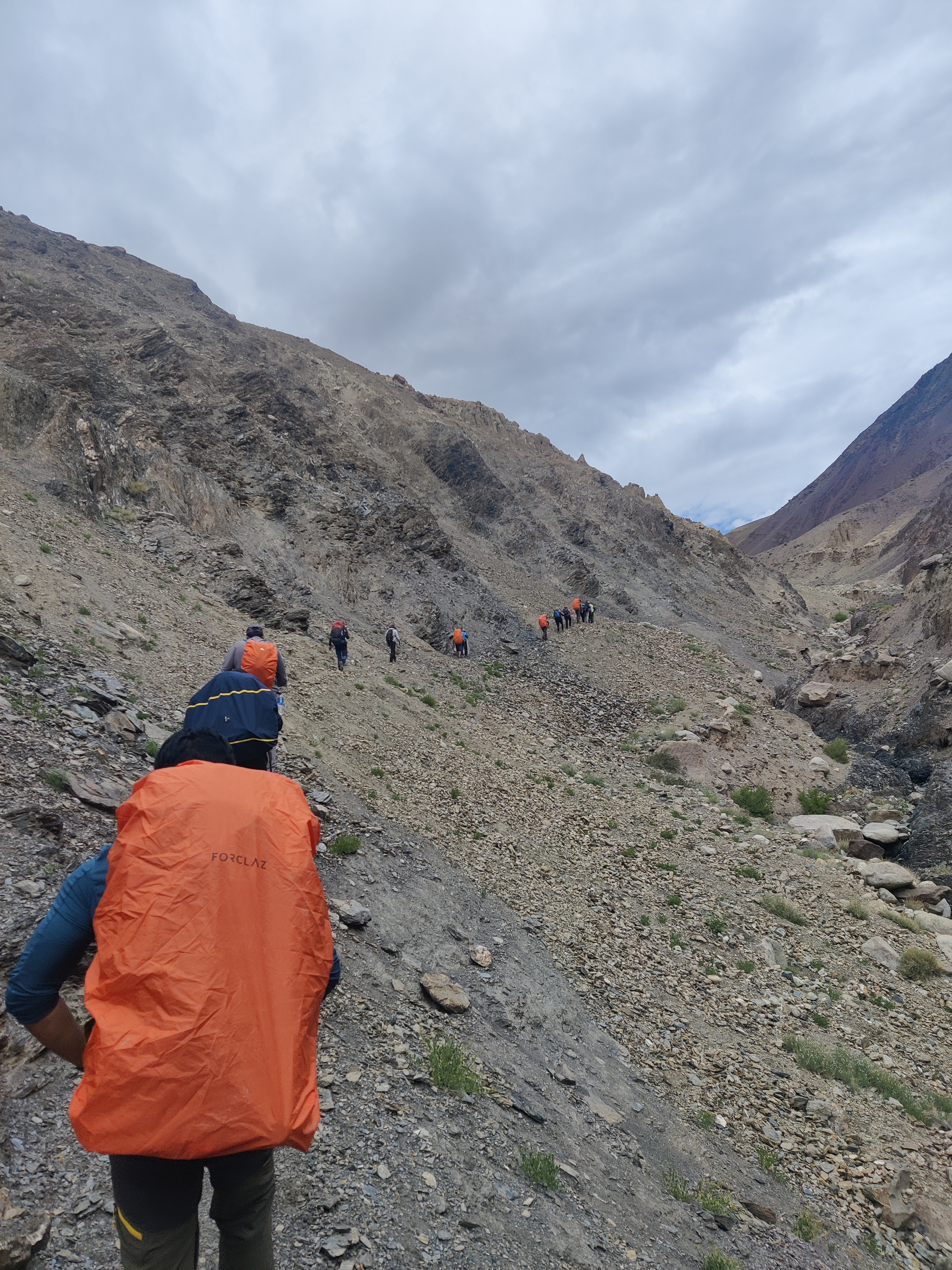 Climbers making their way up a snow-covered ridge towards the Dzo Jongo summit.