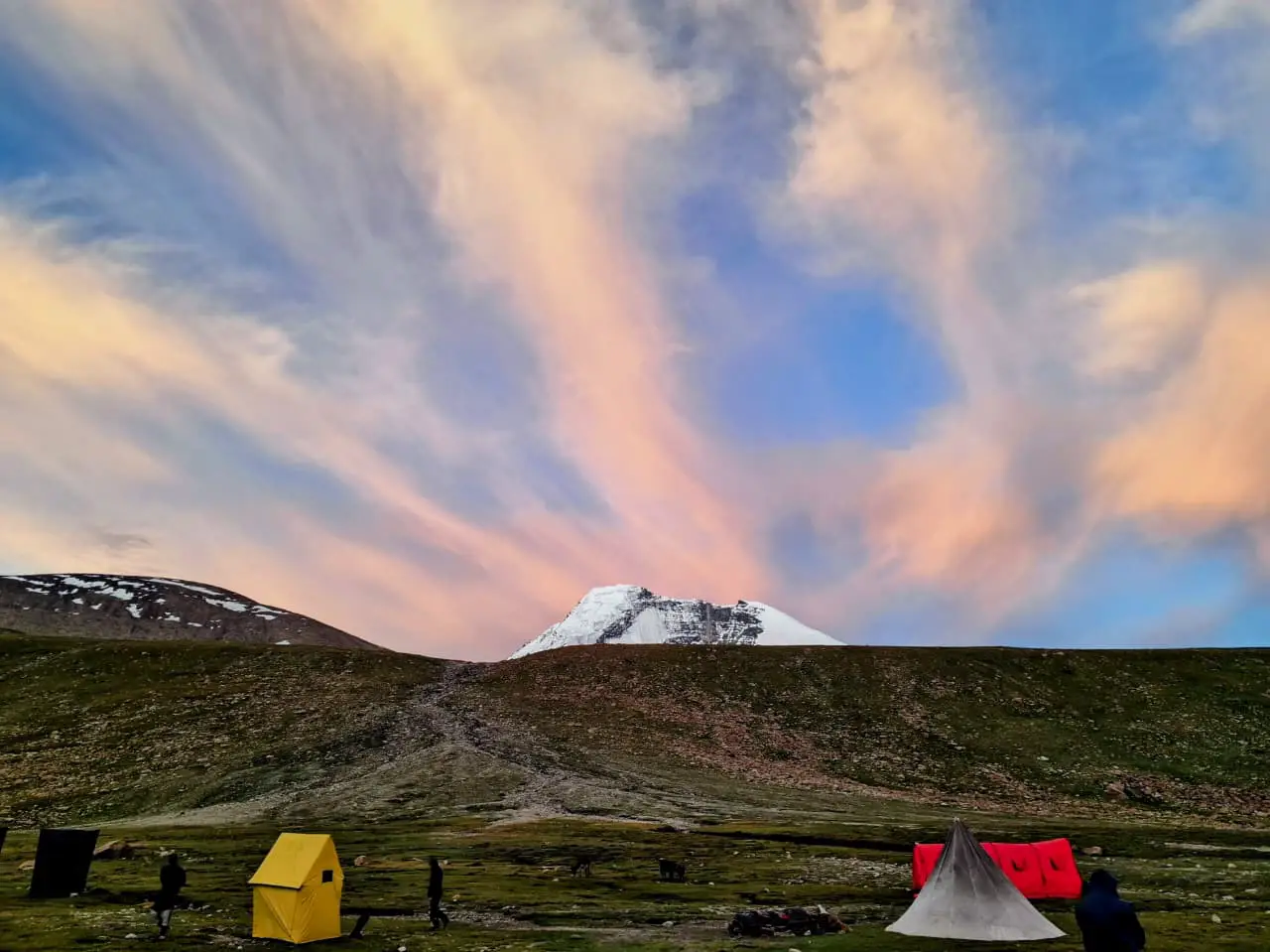 Climbers ascending a snowy slope on Kang Yatse 2
