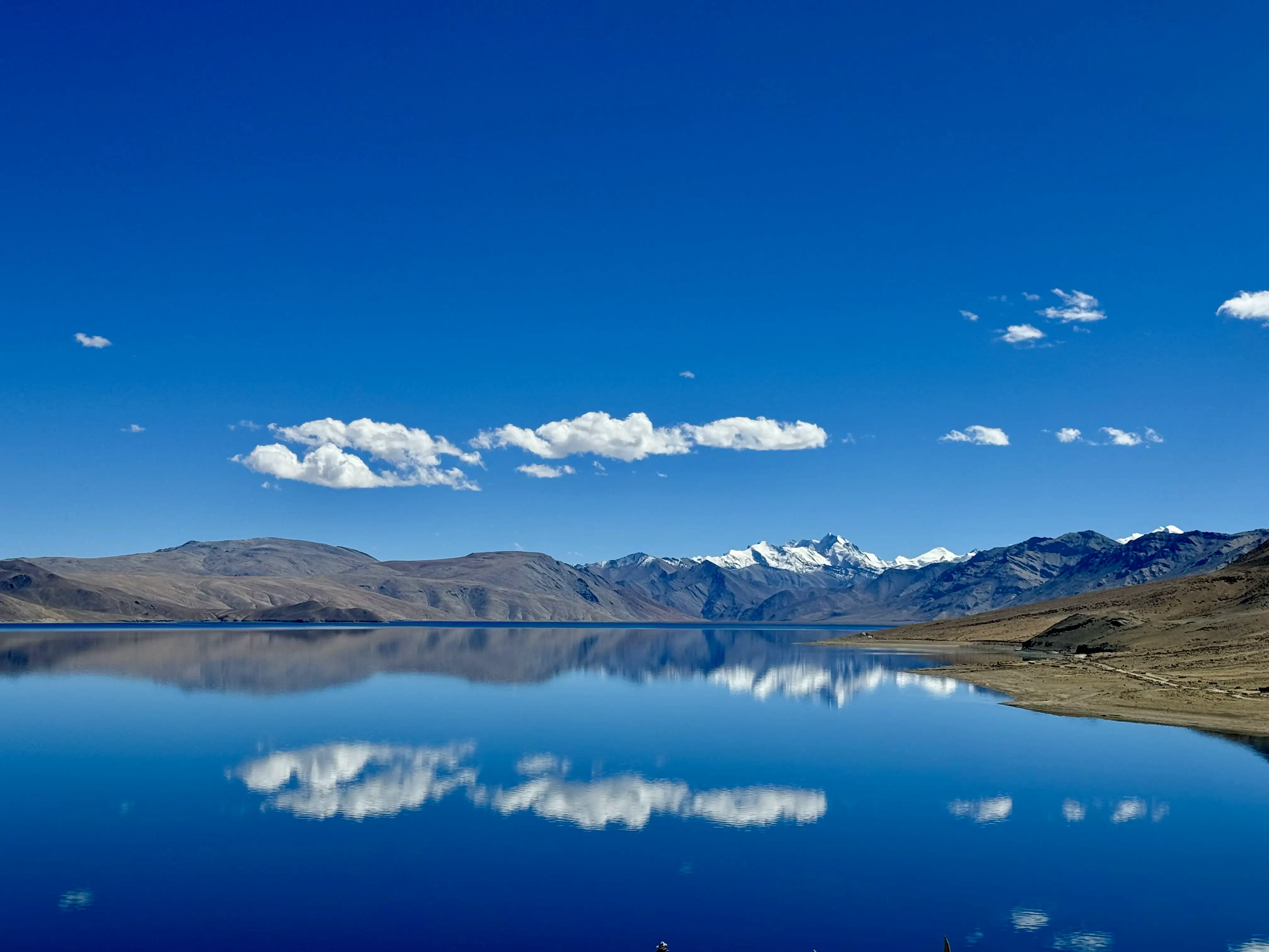 Panoramic view from the summit of Kiagar Ri, showing the vast Himalayan landscape.