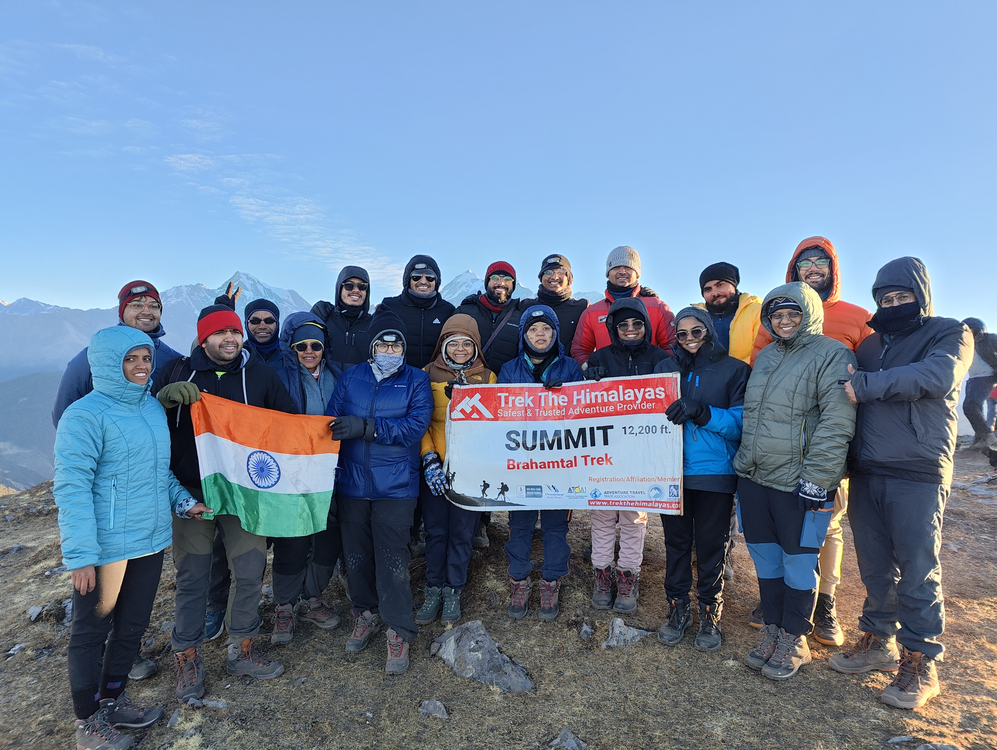 A wide shot of the brahmatal mountain range under a clear blue sky.