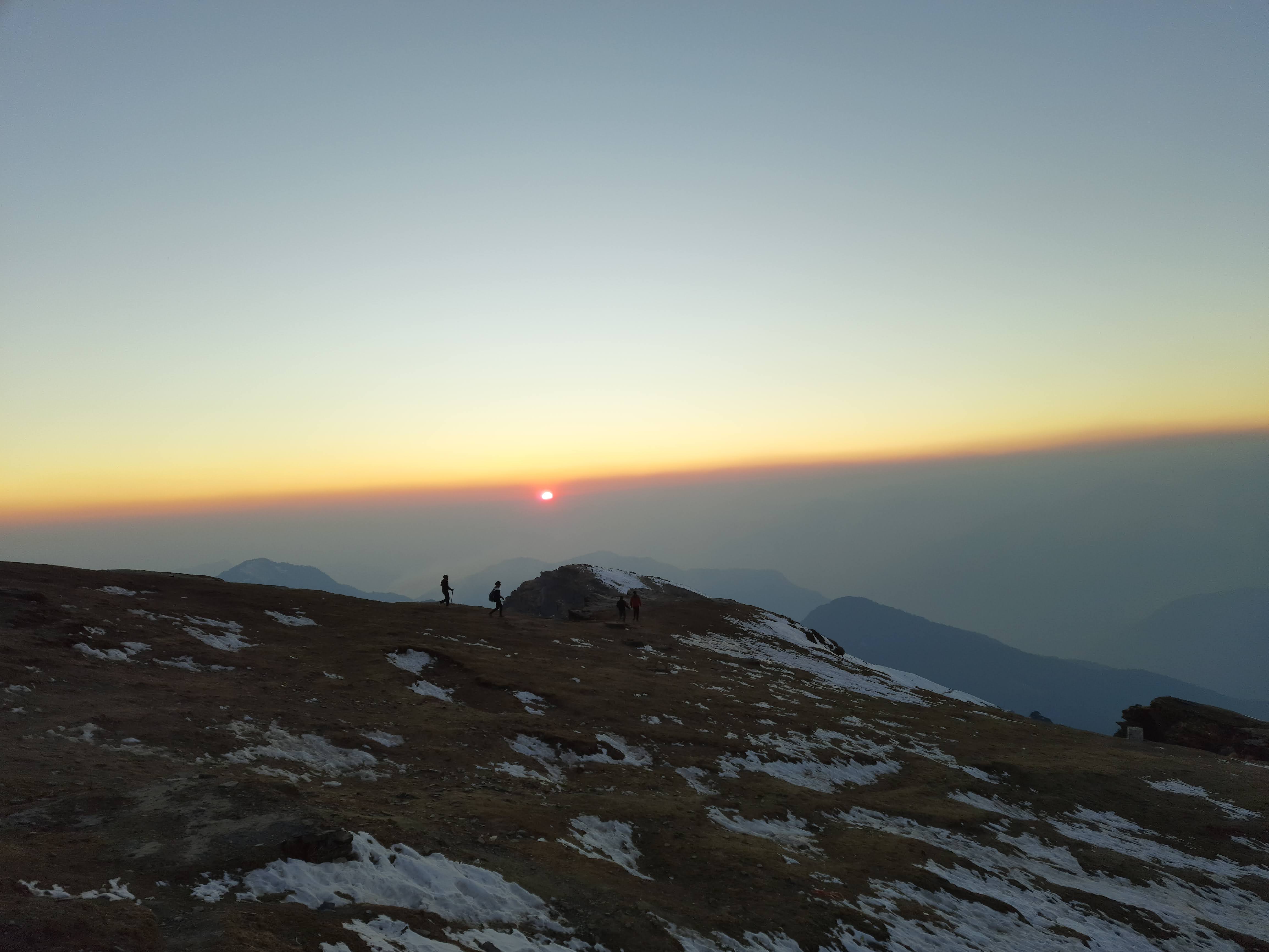 Panoramic view from the summit of chandrashila, showing the vast Himalayan landscape.