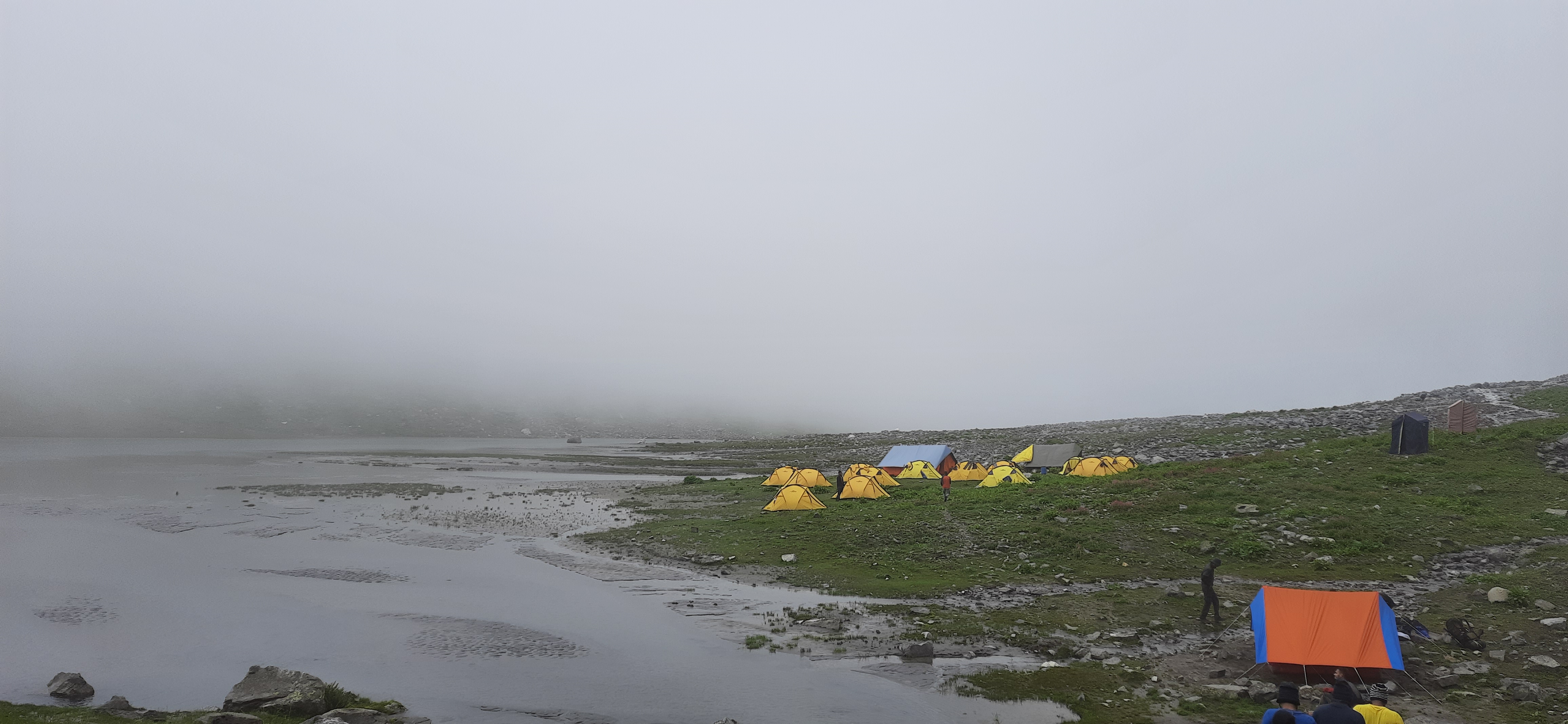 Panoramic view from the summit of hampta pass, showing the vast Himalayan landscape.