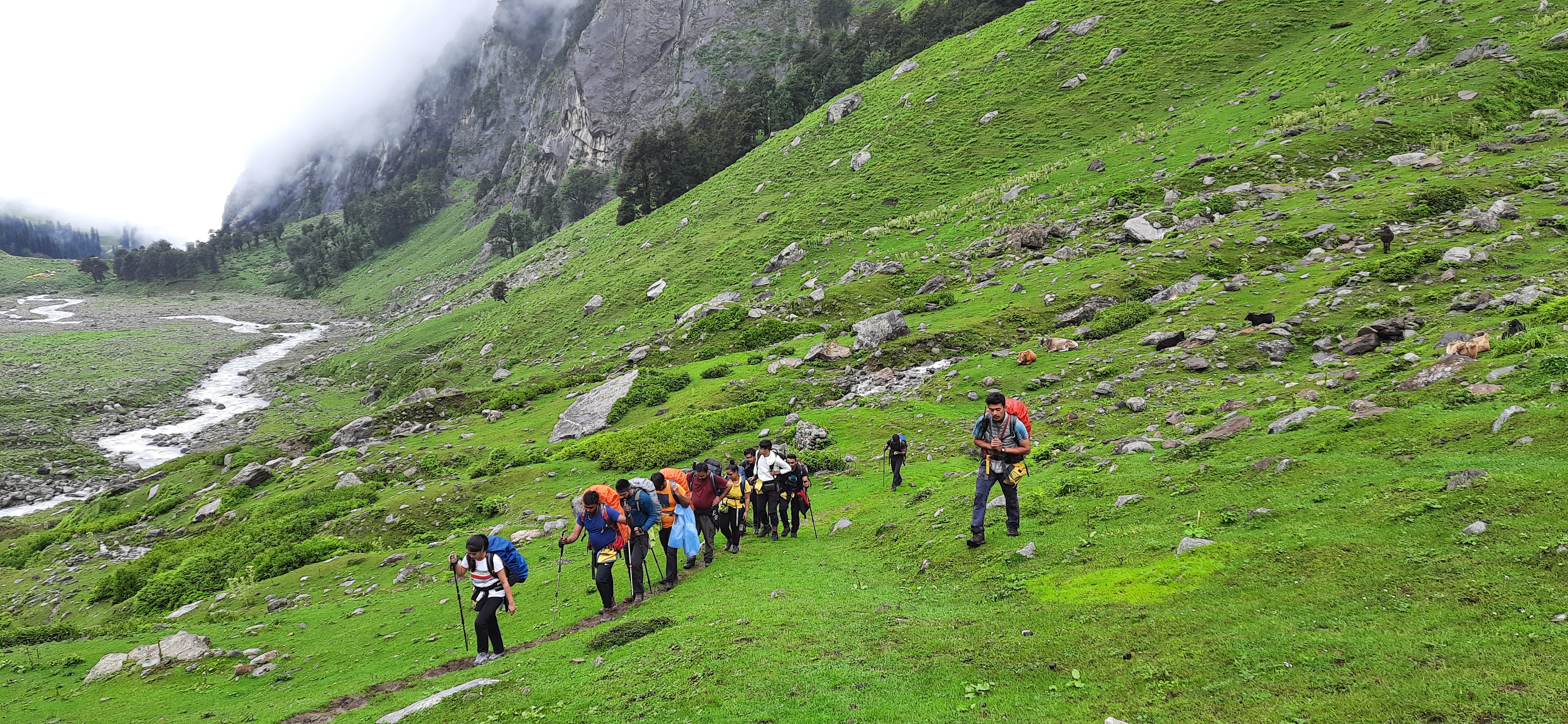 Panoramic view from the summit of hampta pass, showing the vast Himalayan landscape.
