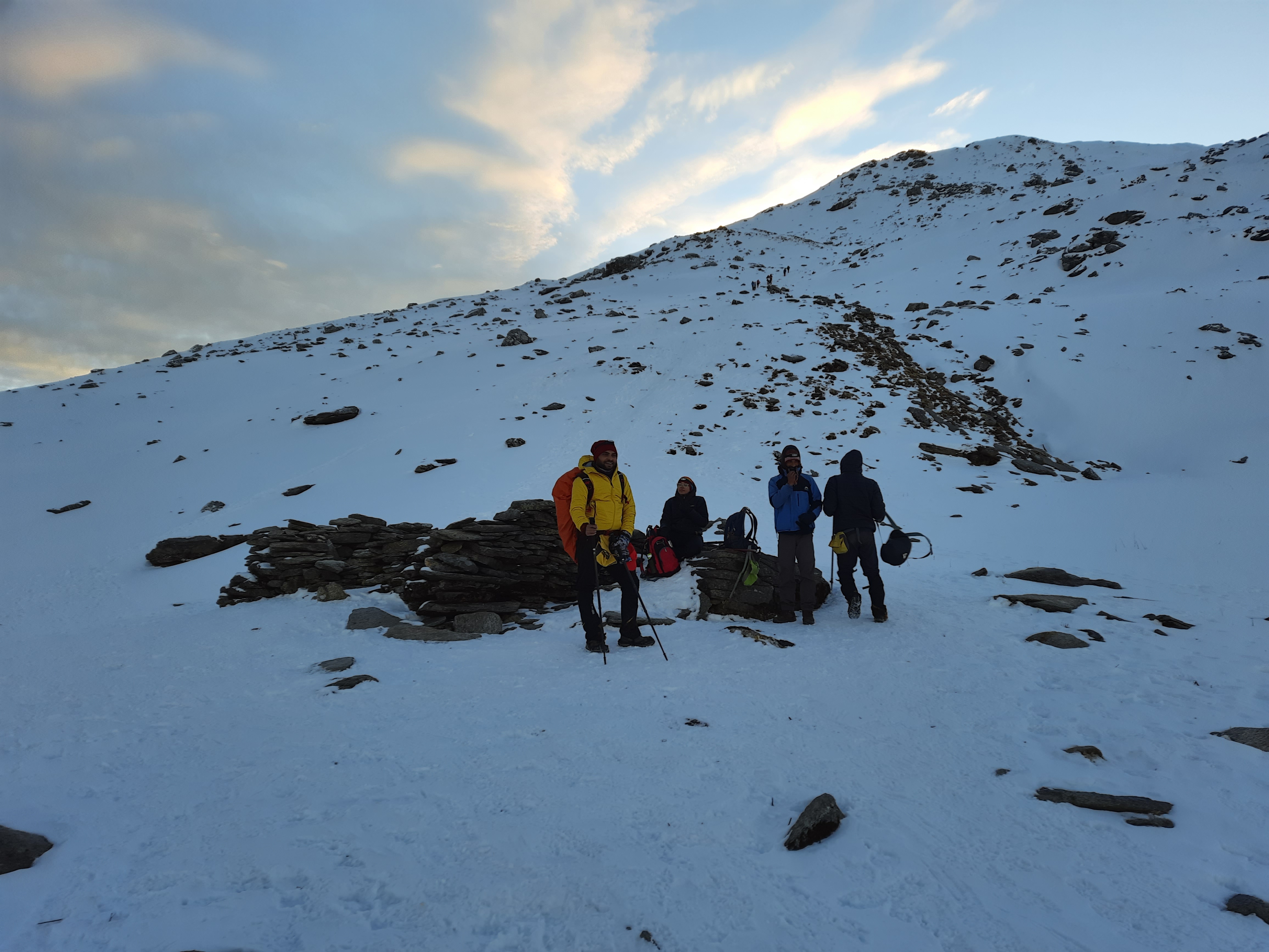 Panoramic view from the summit of Kedarkantha, showing the vast Himalayan landscape.