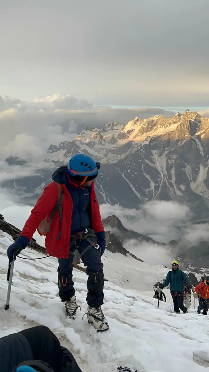A panoramic view showcasing Dzo Jongo, Kang Yatse I, and Kang Yatse II peaks, highlighting the vastness and scale of the Ladakh mountain range.