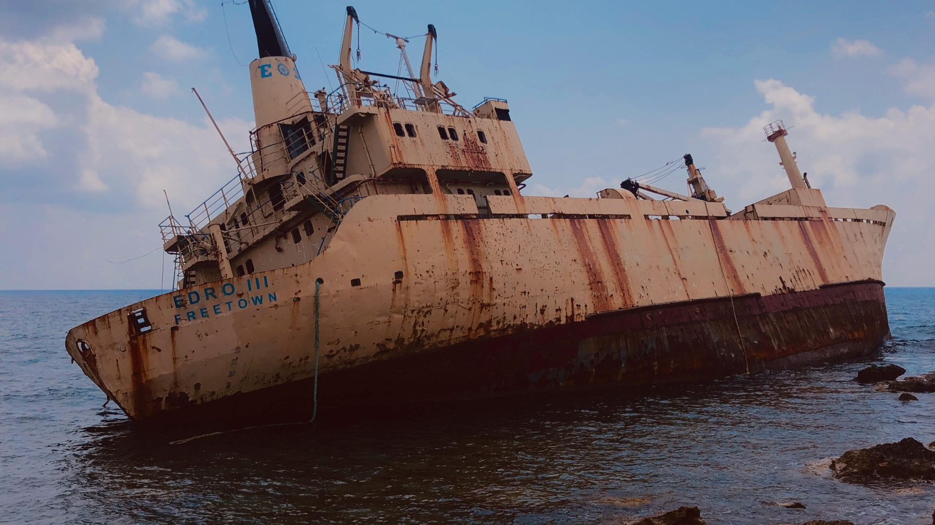 A large pile of scrap metal from a ship ready for recycling.