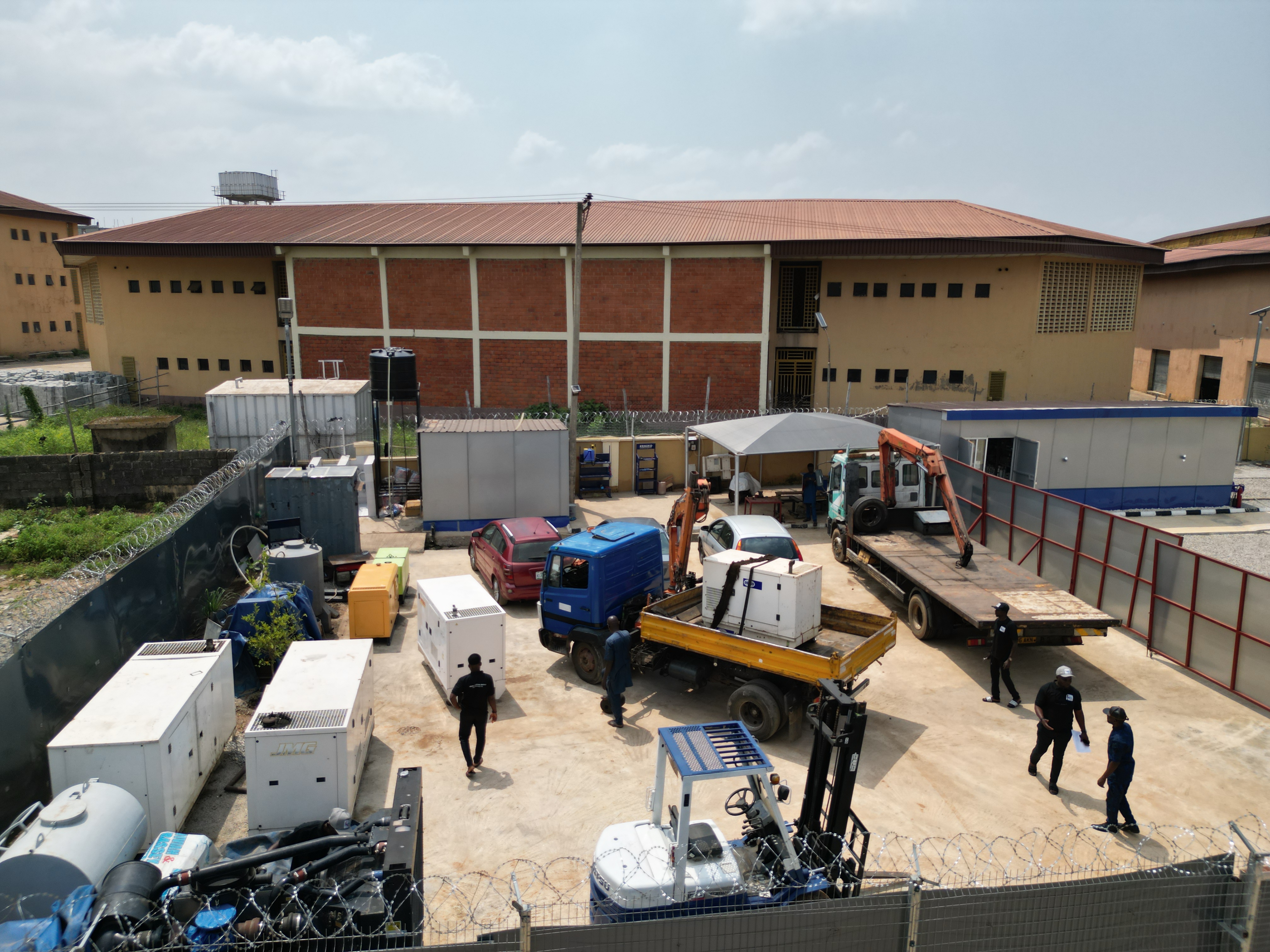 A team of engineers collaborating on a blueprint in a modern office.