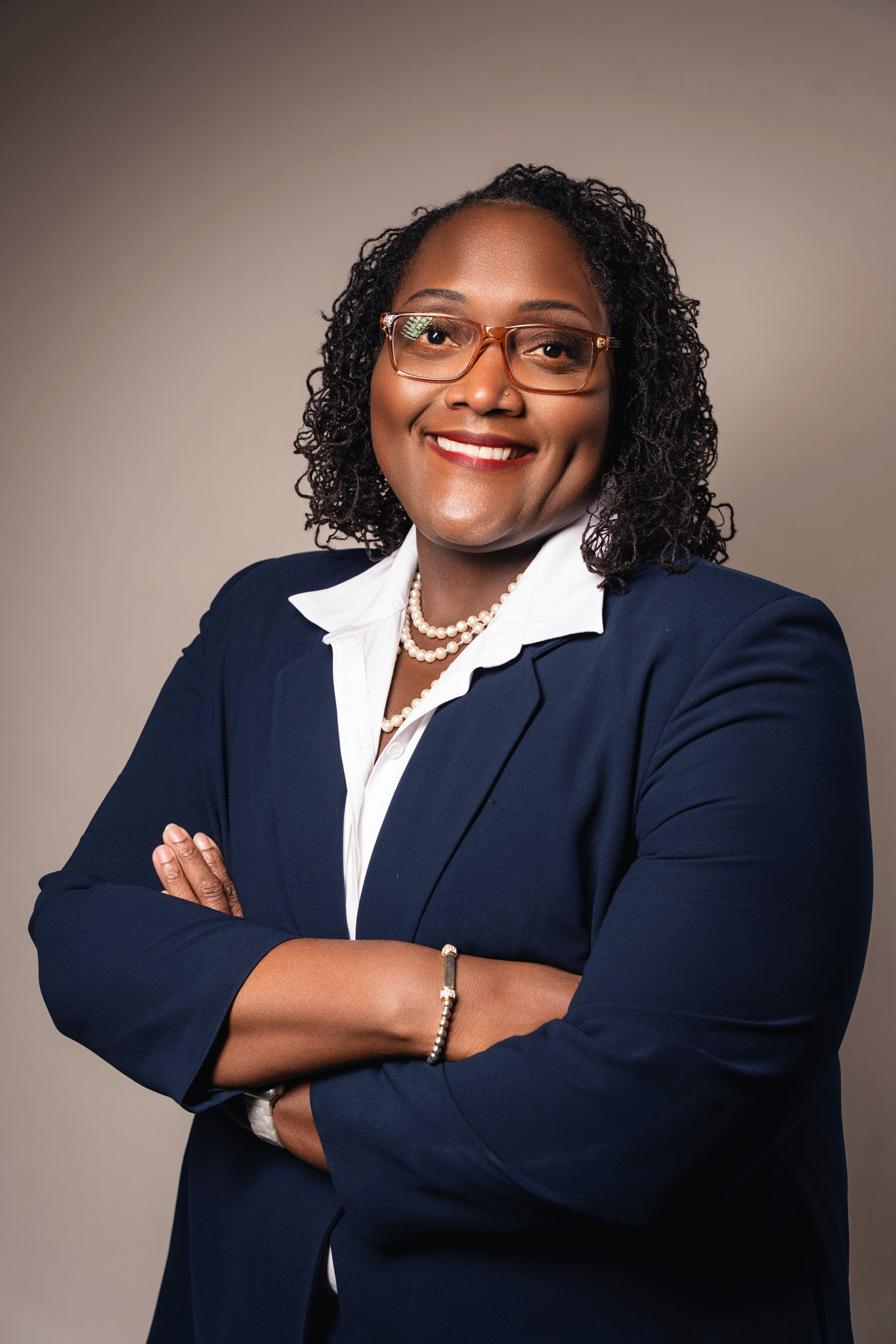 A warm and professional headshot of a female life coach.