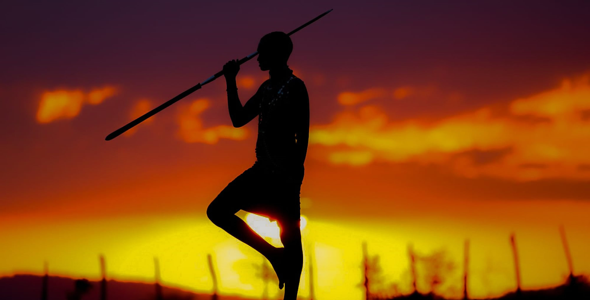 A stunning, clear view of Mount Kilimanjaro with elephants grazing in the foreground.