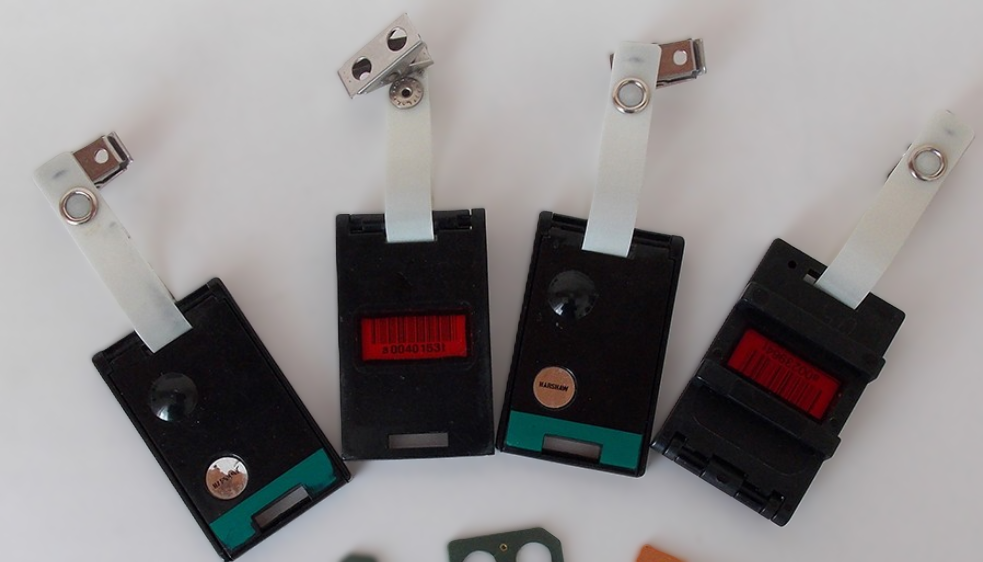 A display of TLD badge dosimeters for an occupational dose monitoring service in Uganda.