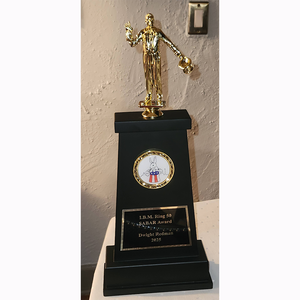 Magician with a trophy.