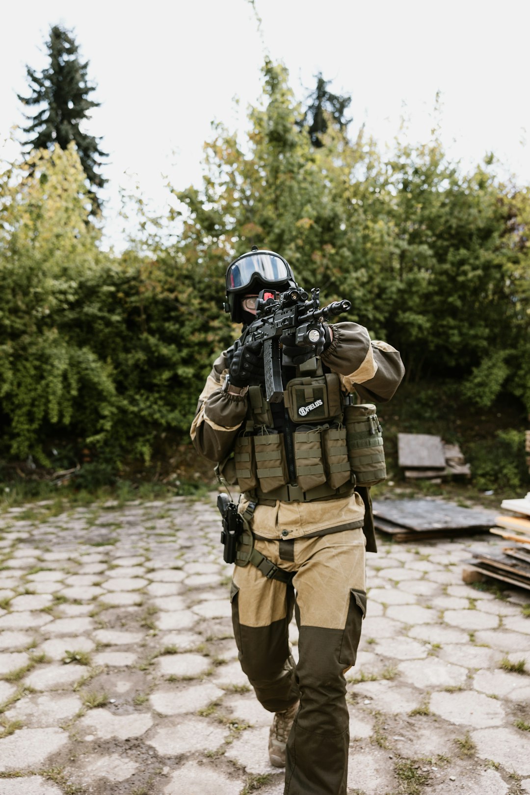A security officer in full tactical gear, standing alert.