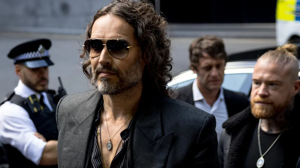 Russell Brand leaving court.