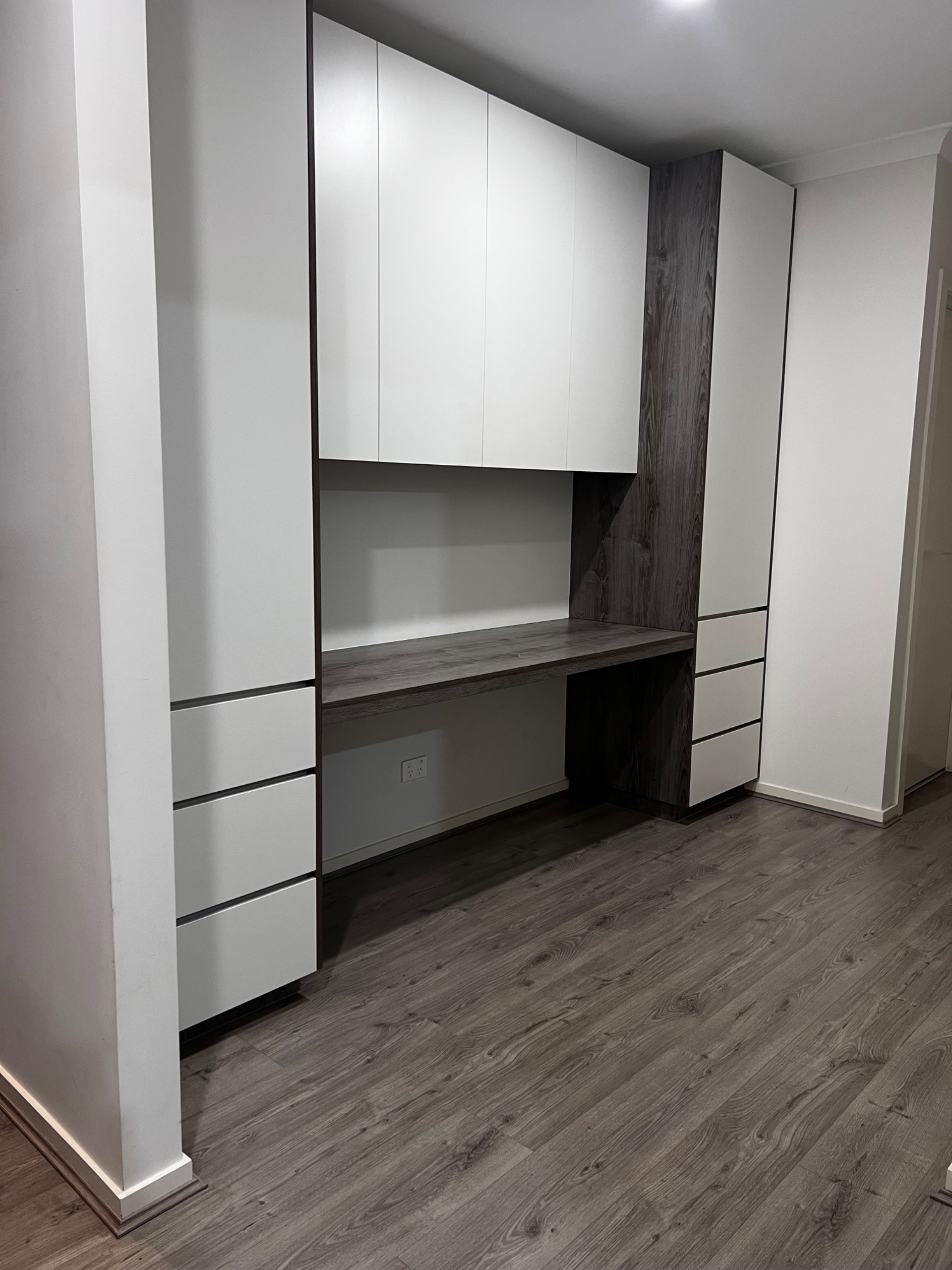 A custom study nook with built-in desk and shelving in Strathtulloh.