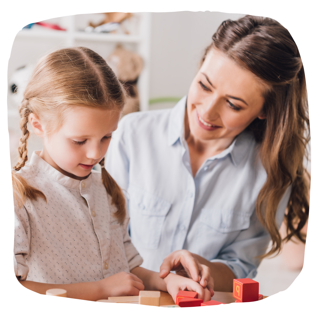 A professional engaging with a child in a supportive setting.
