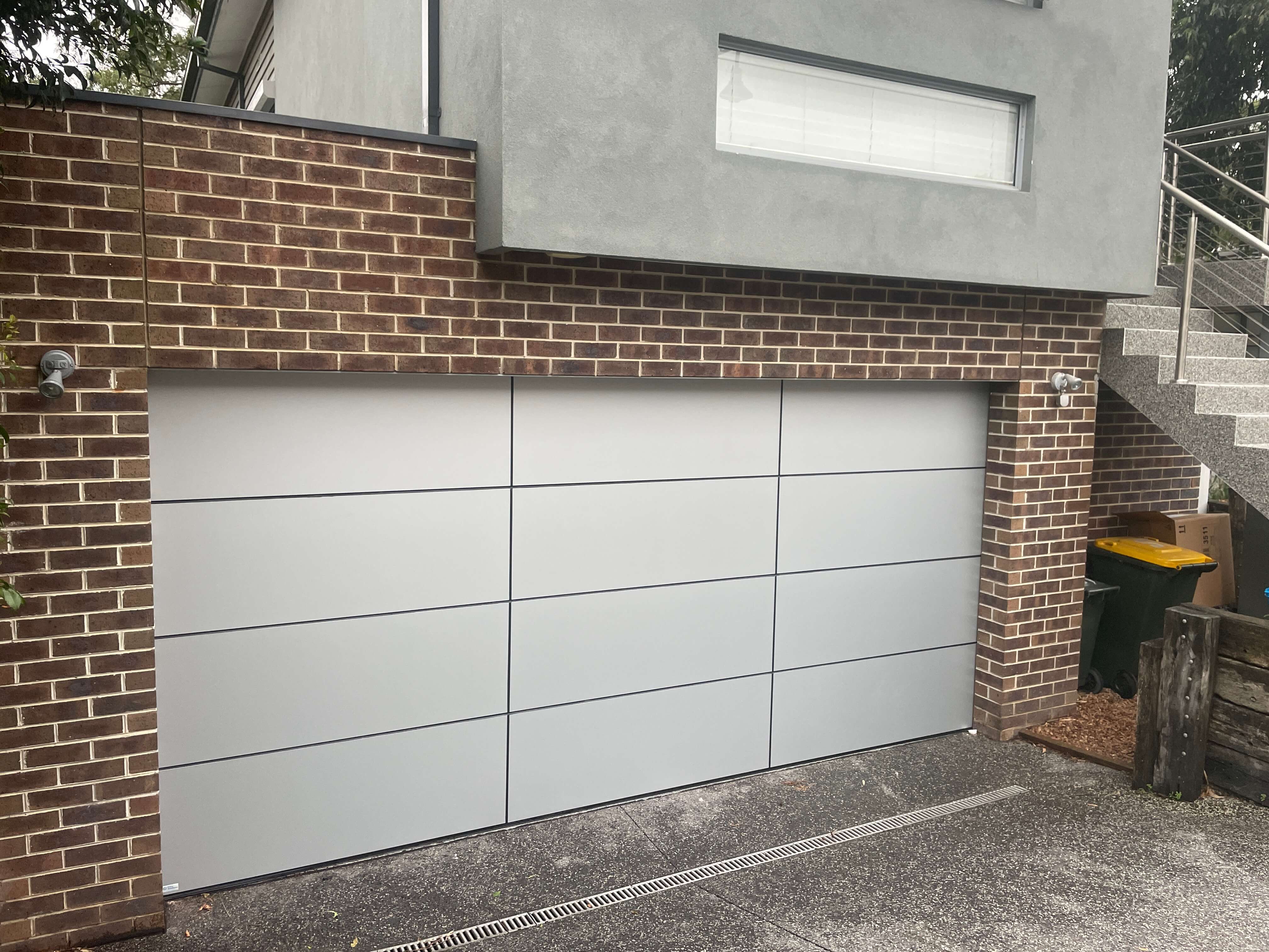 Alucabond Silver Sectional Door with Extra Panel.