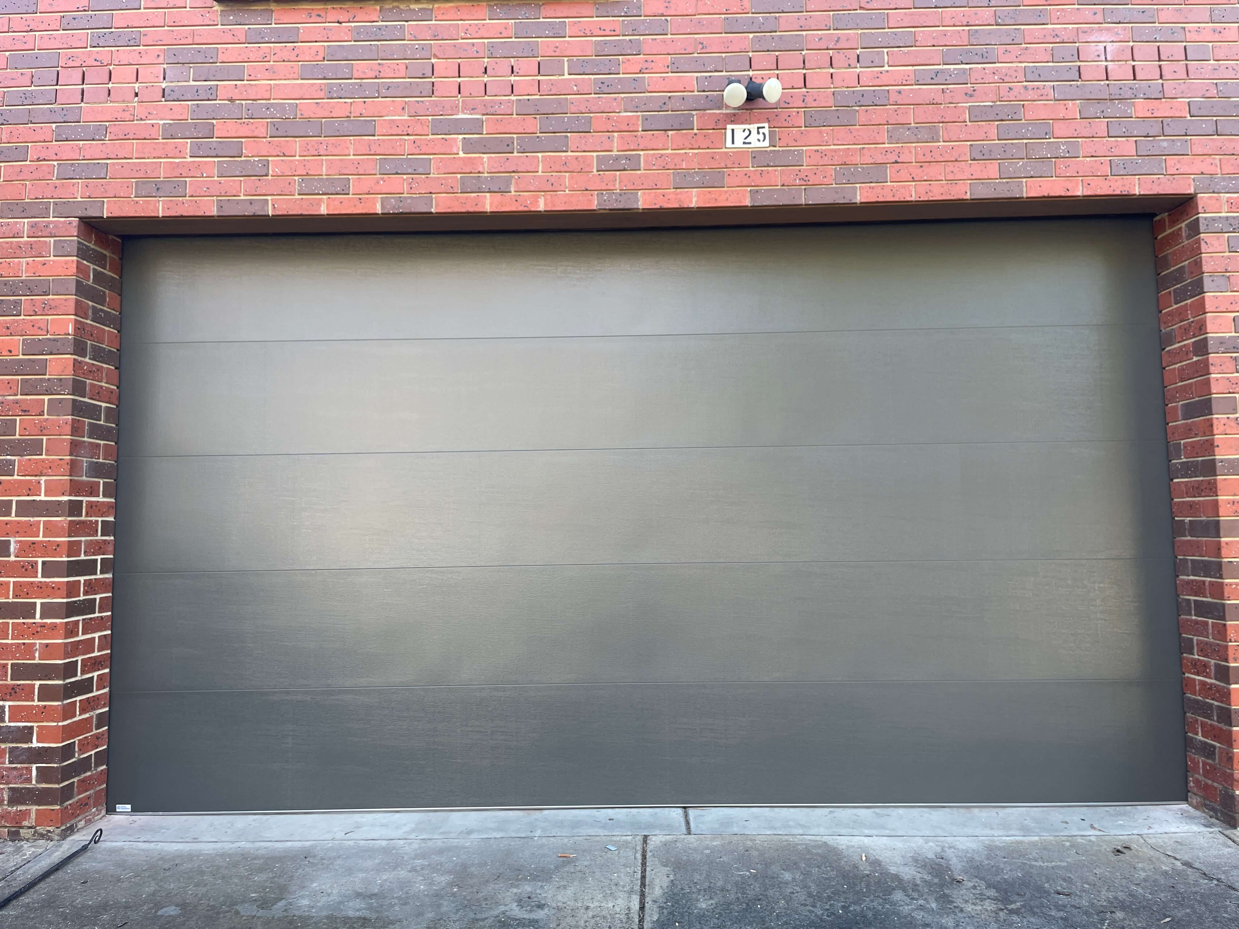 Madison Woodland Gray Sectional Door.