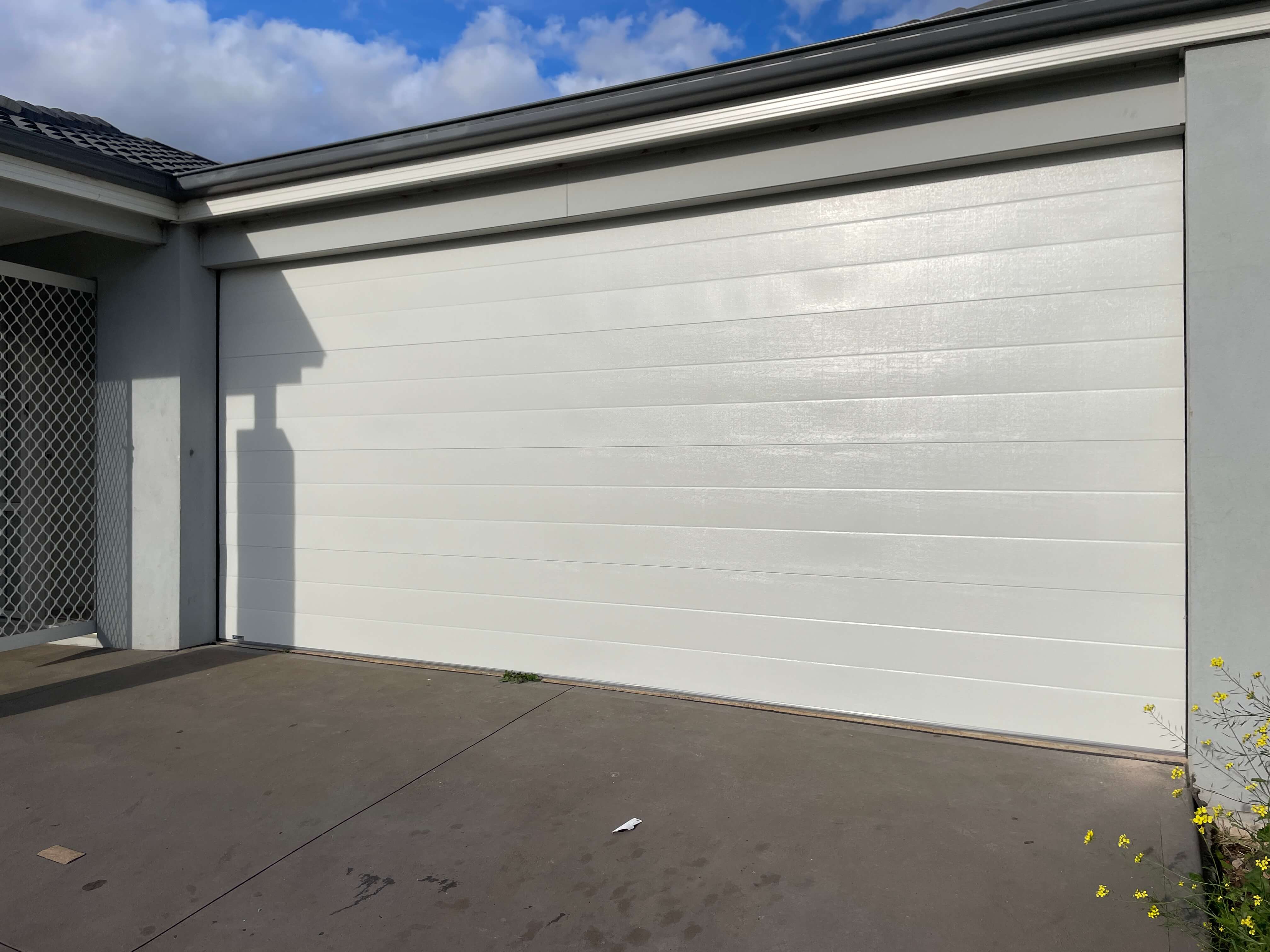 Tuscan Surfmist Sectional Door with LHR.