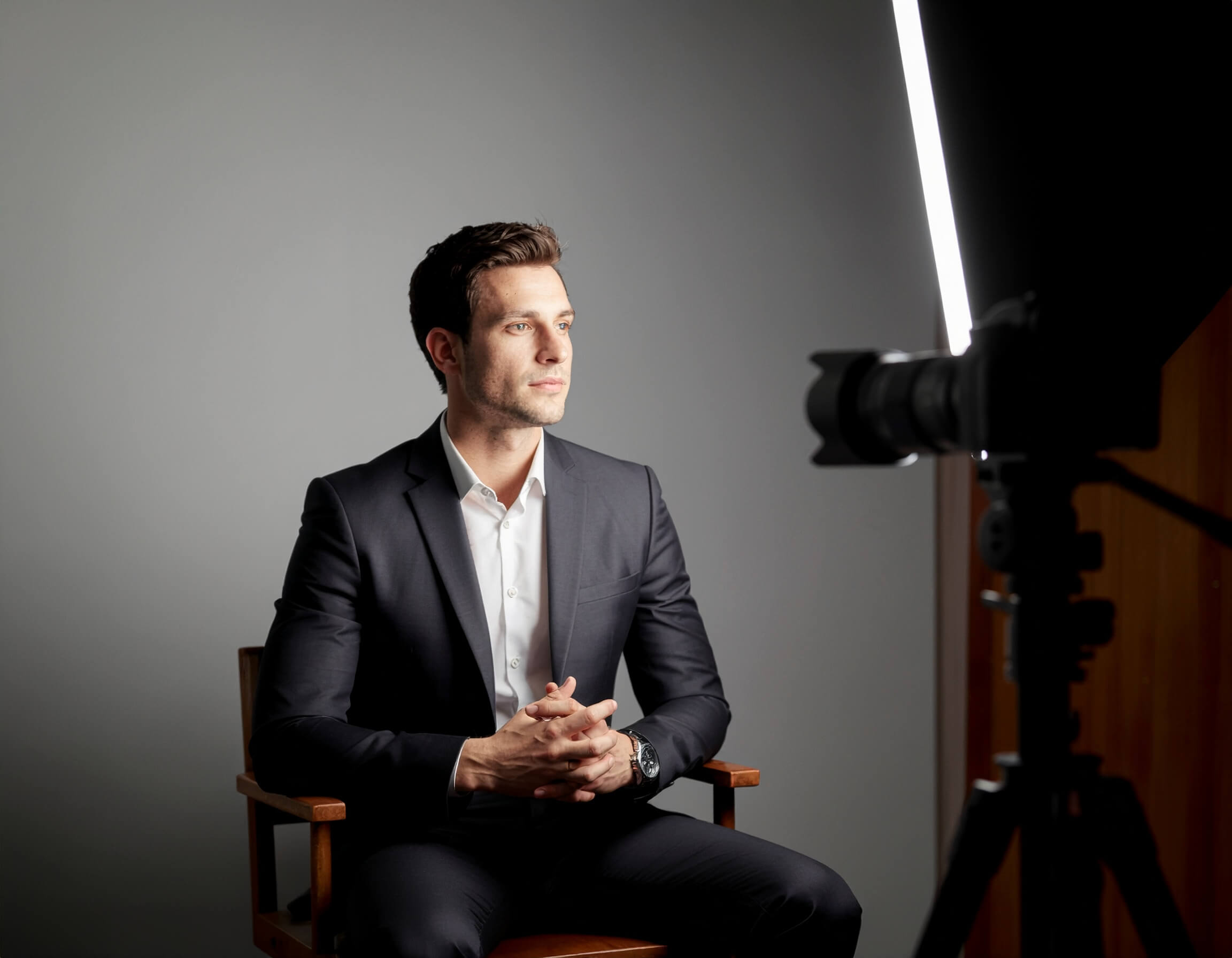 A video production crew filming an interview.