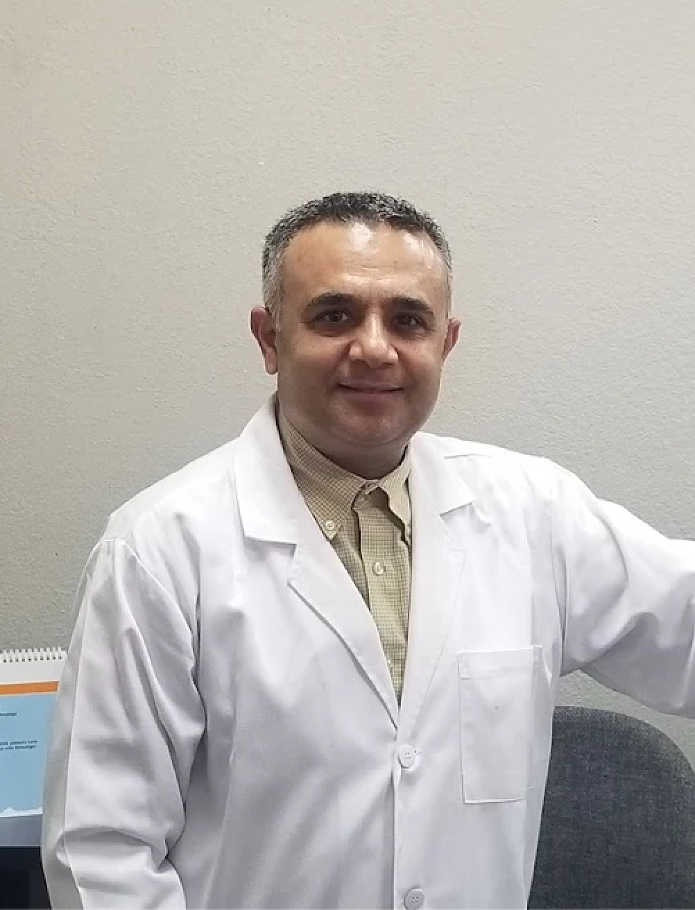 Professional and friendly headshot of the main dentist.