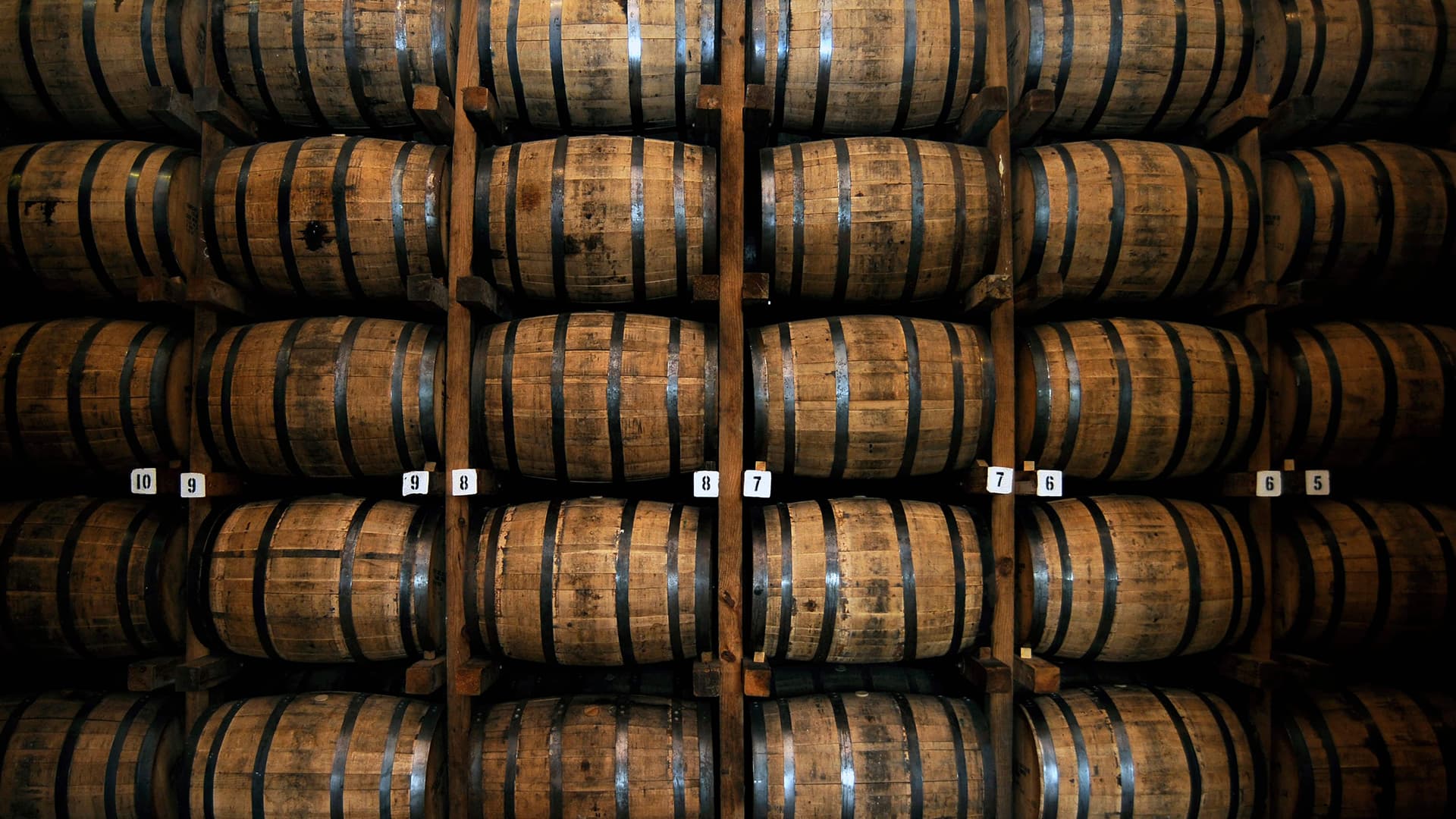 A close-up of a copper still in a distillery.