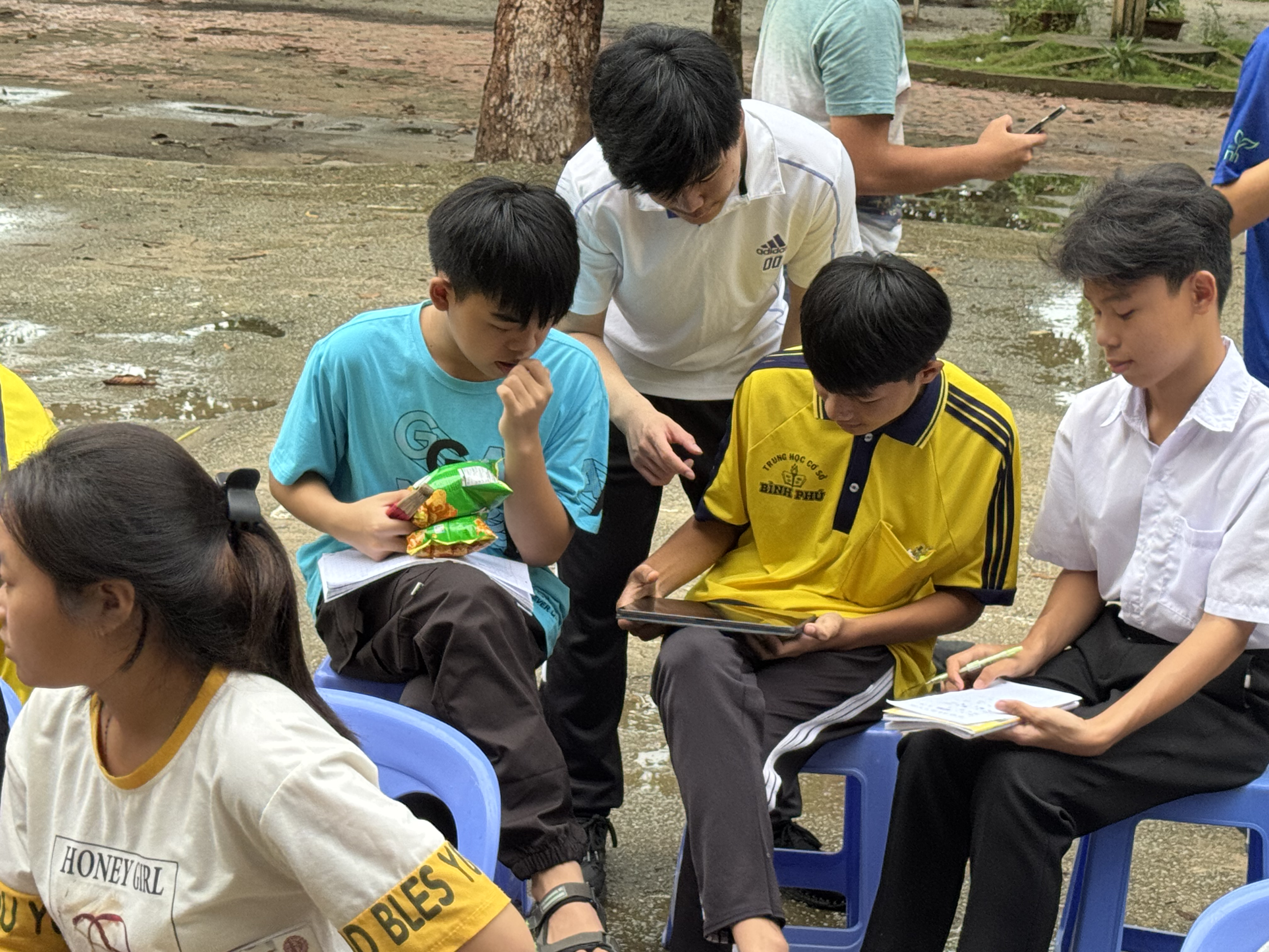 Students engaged in a computational math program on laptops.