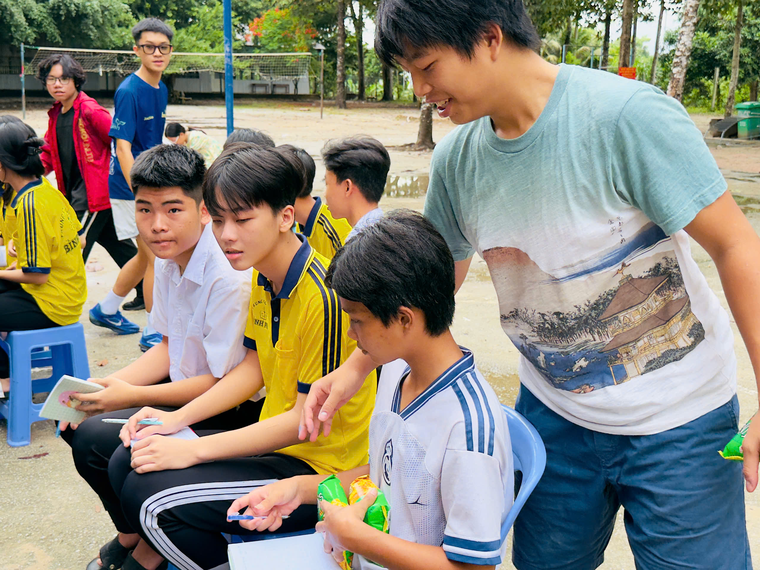 A mentor helping a student with their work.