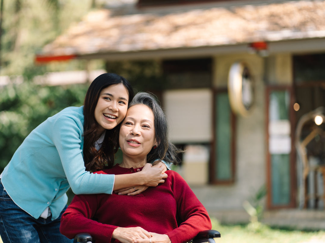 A caregiver and participant working together on a tablet, illustrating our collaborative approach.