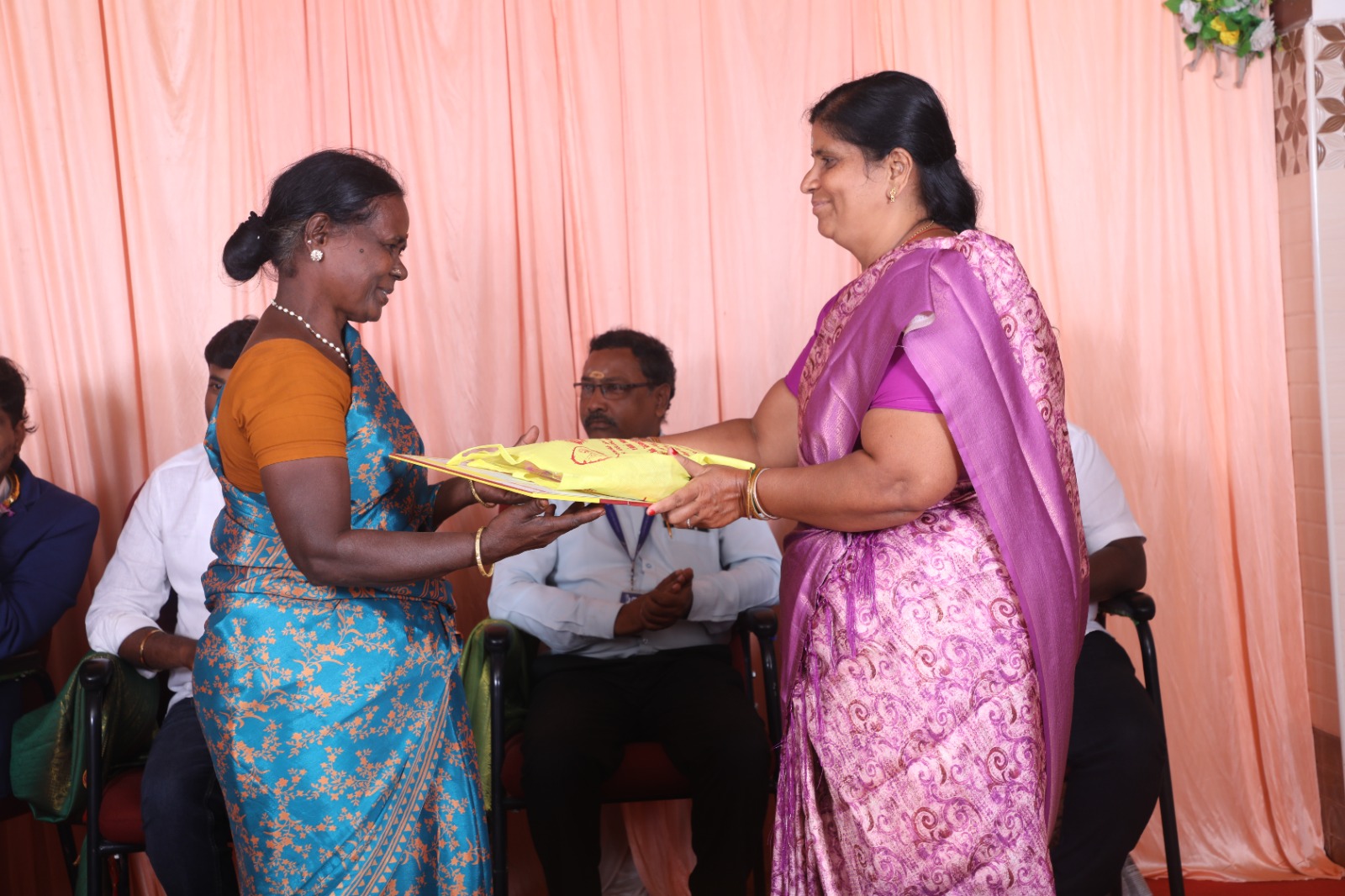 Volunteers sorting through clothing donations.