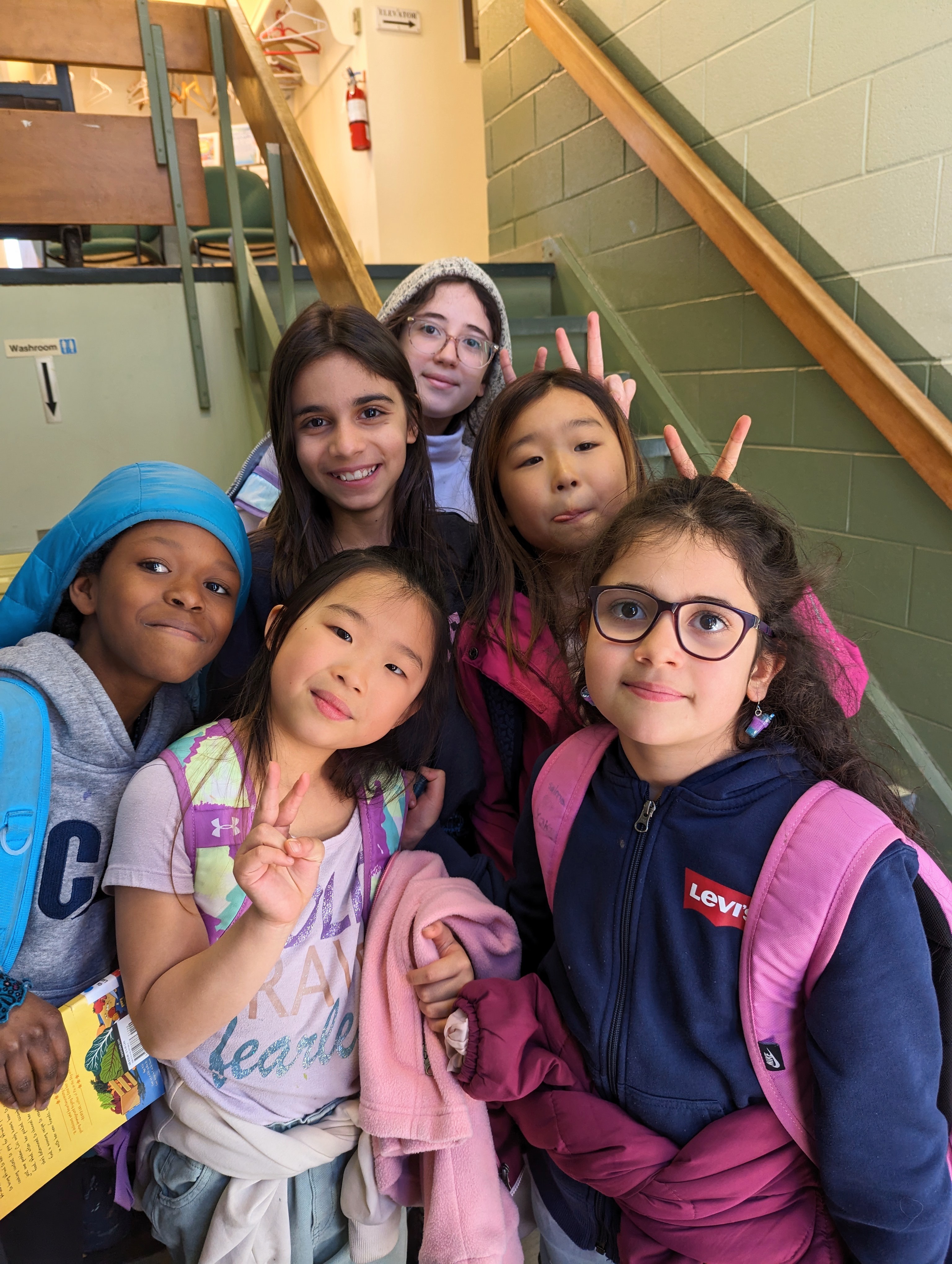 A group of smiling volunteers at an event.