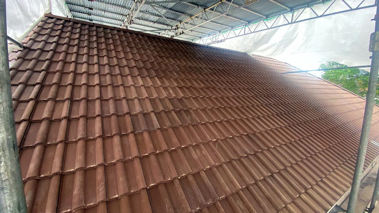 New brown double roman tiles on a Bristol new build roof, the standard to compare against on a roof maintenance checklist