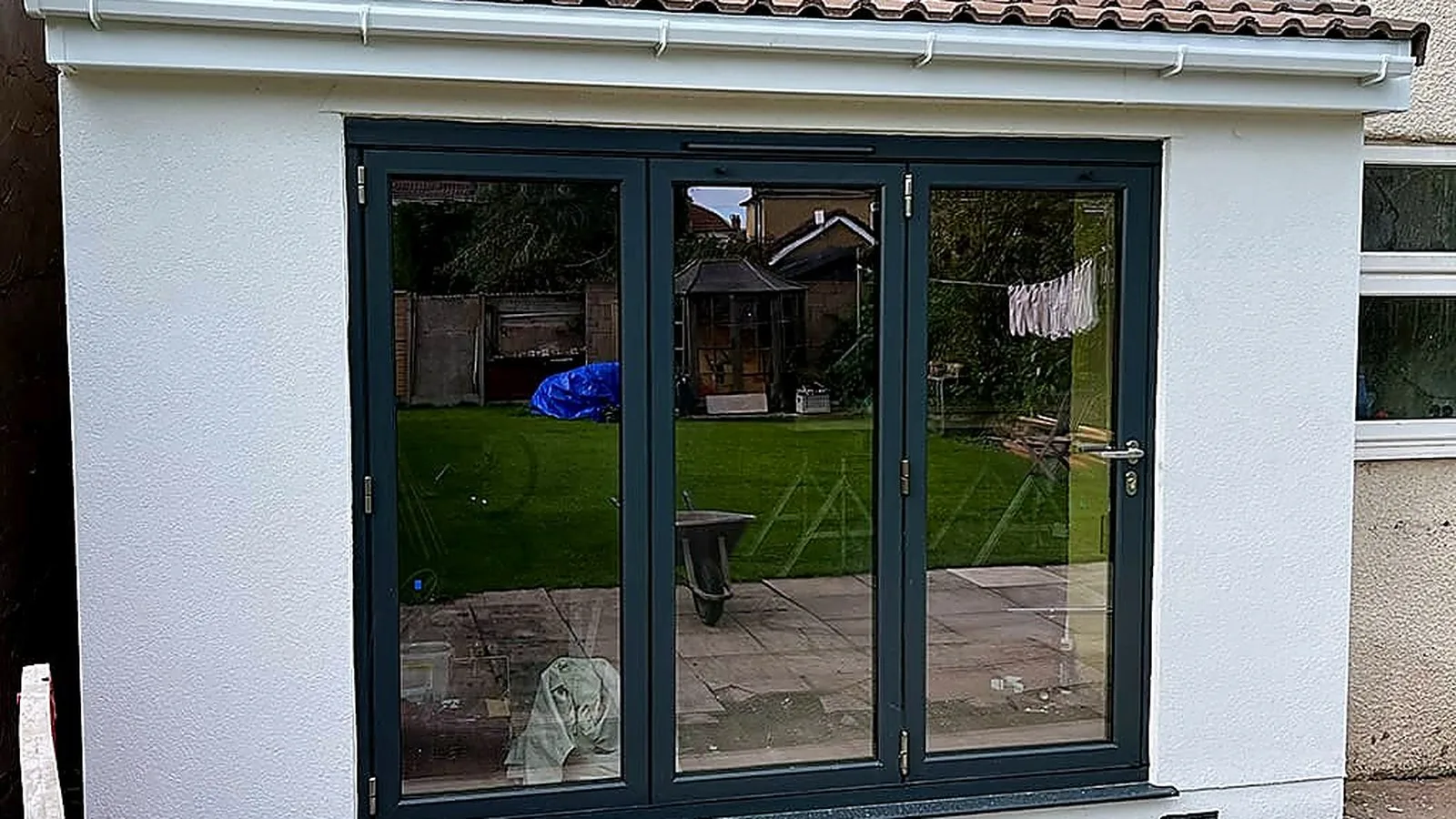 Grey bifold doors in a new rear extension, the kind of upgrade a flood damage reinstatement can include