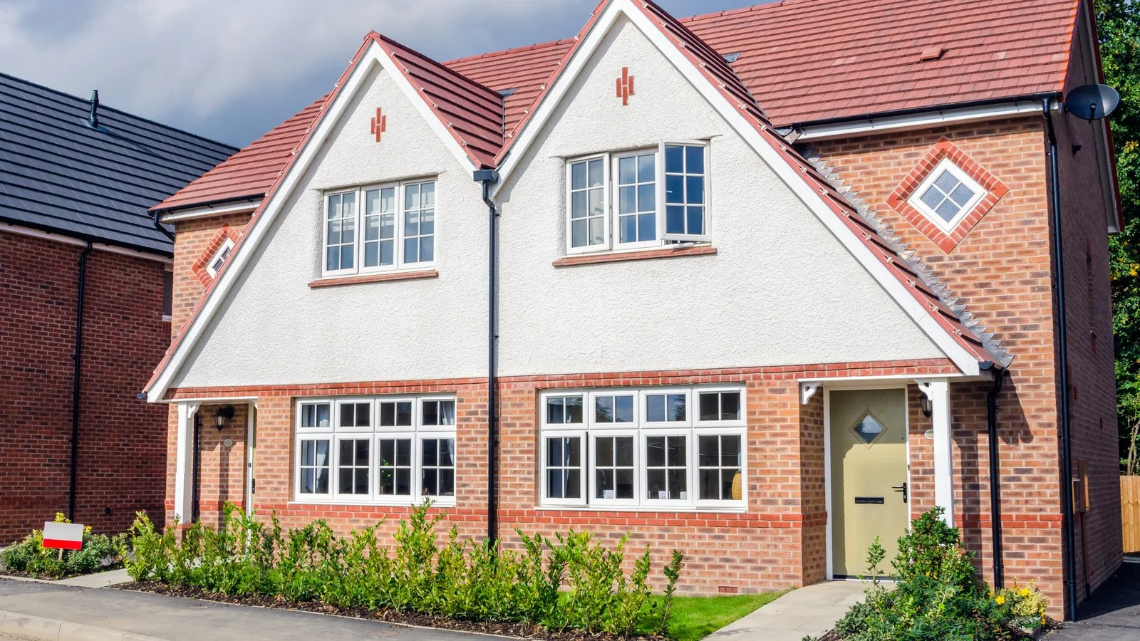Brick semi-detached houses with rendered gables, the kind of home where two-storey extension planning permission comes up