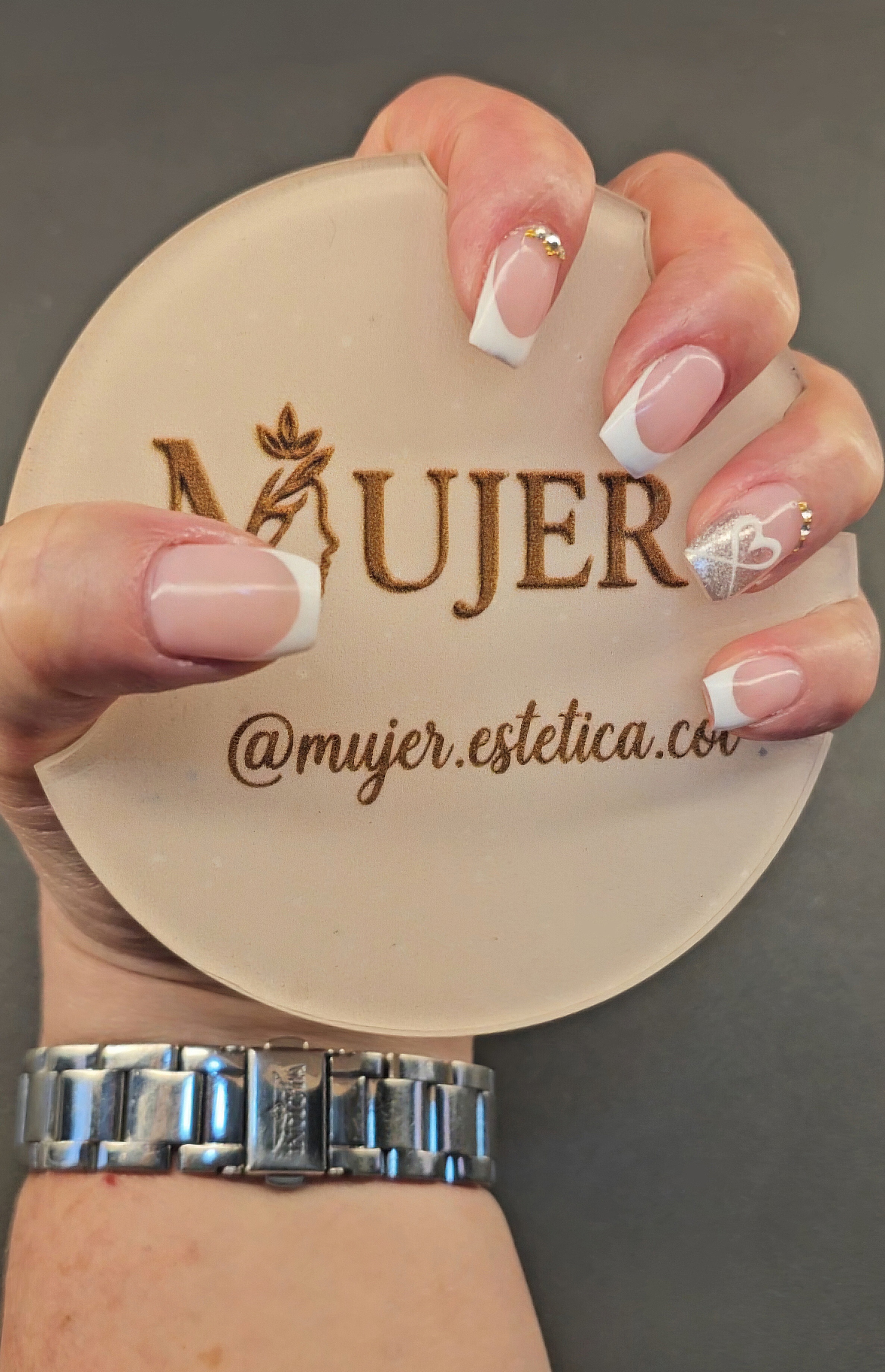 Nails with gel or acrylic extensions.