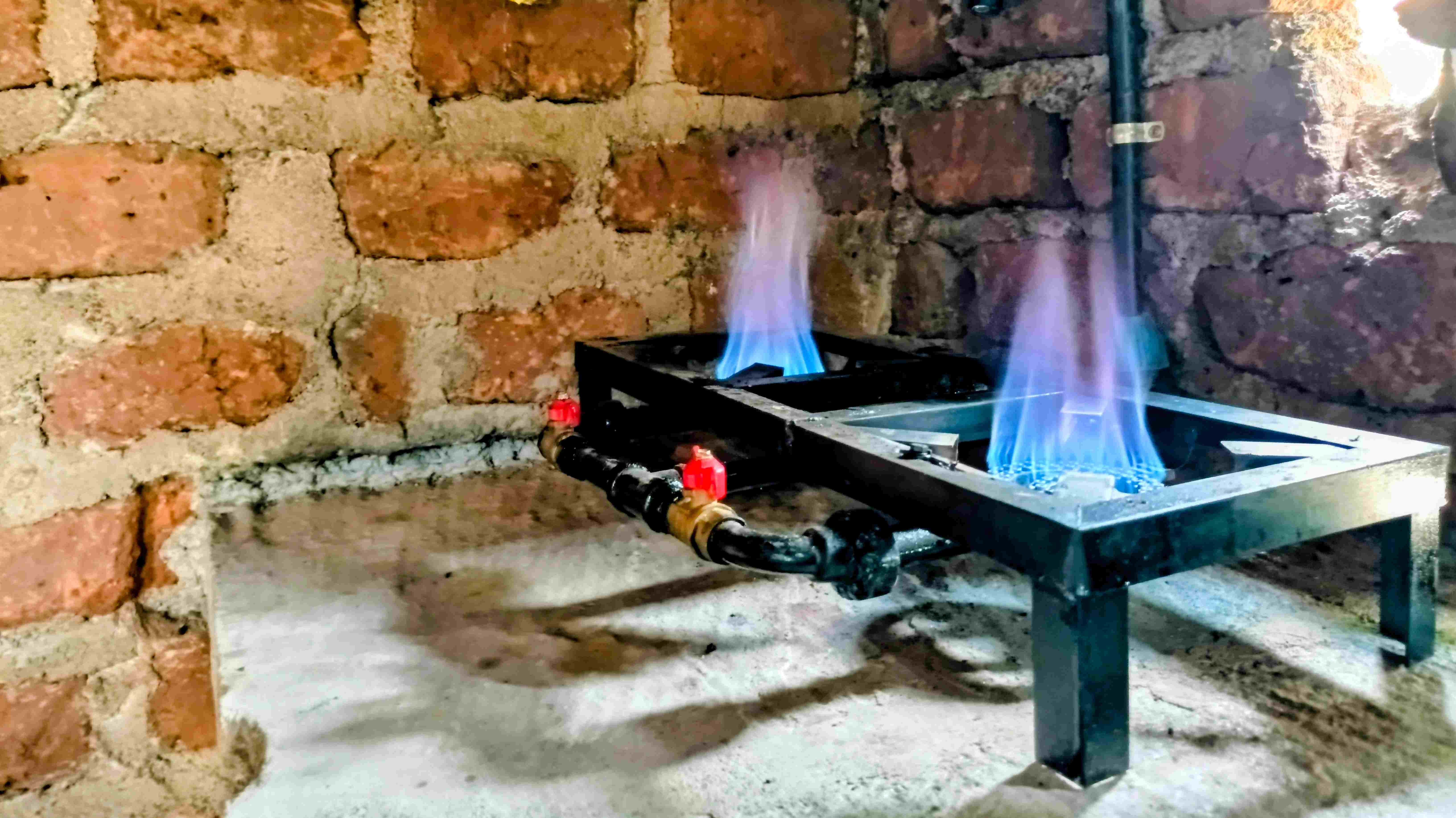 A clean, modern kitchen with a person cooking.