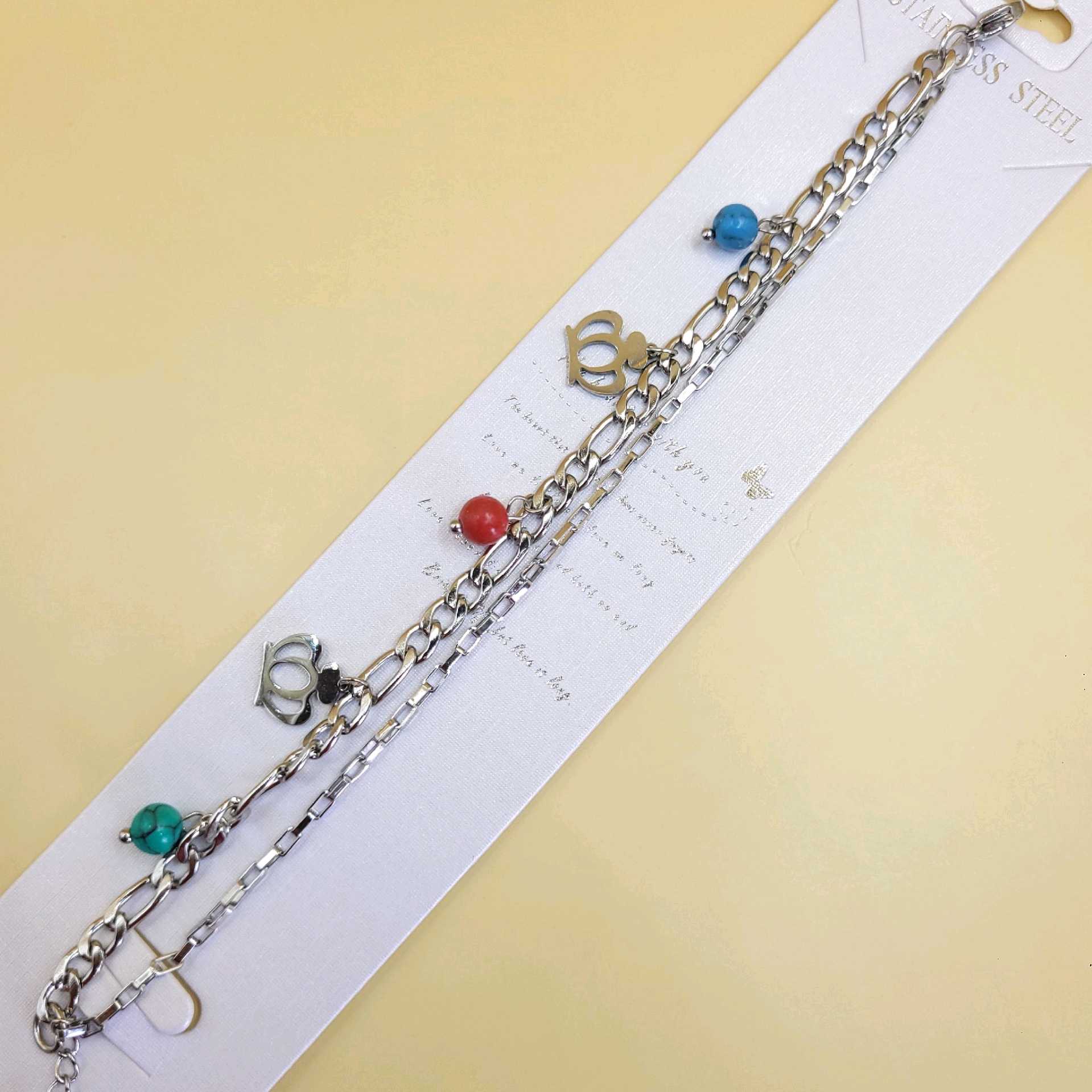 Pulsera tono plata coronas / acero inoxidable 