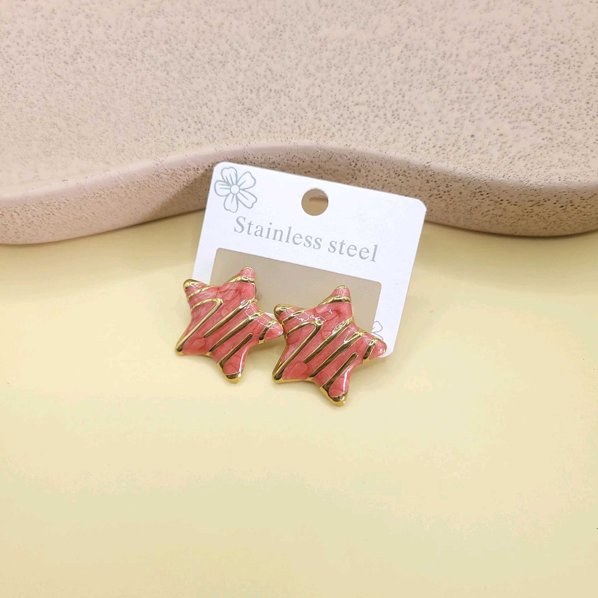 Aretes estrella salmón/ acero inoxidable