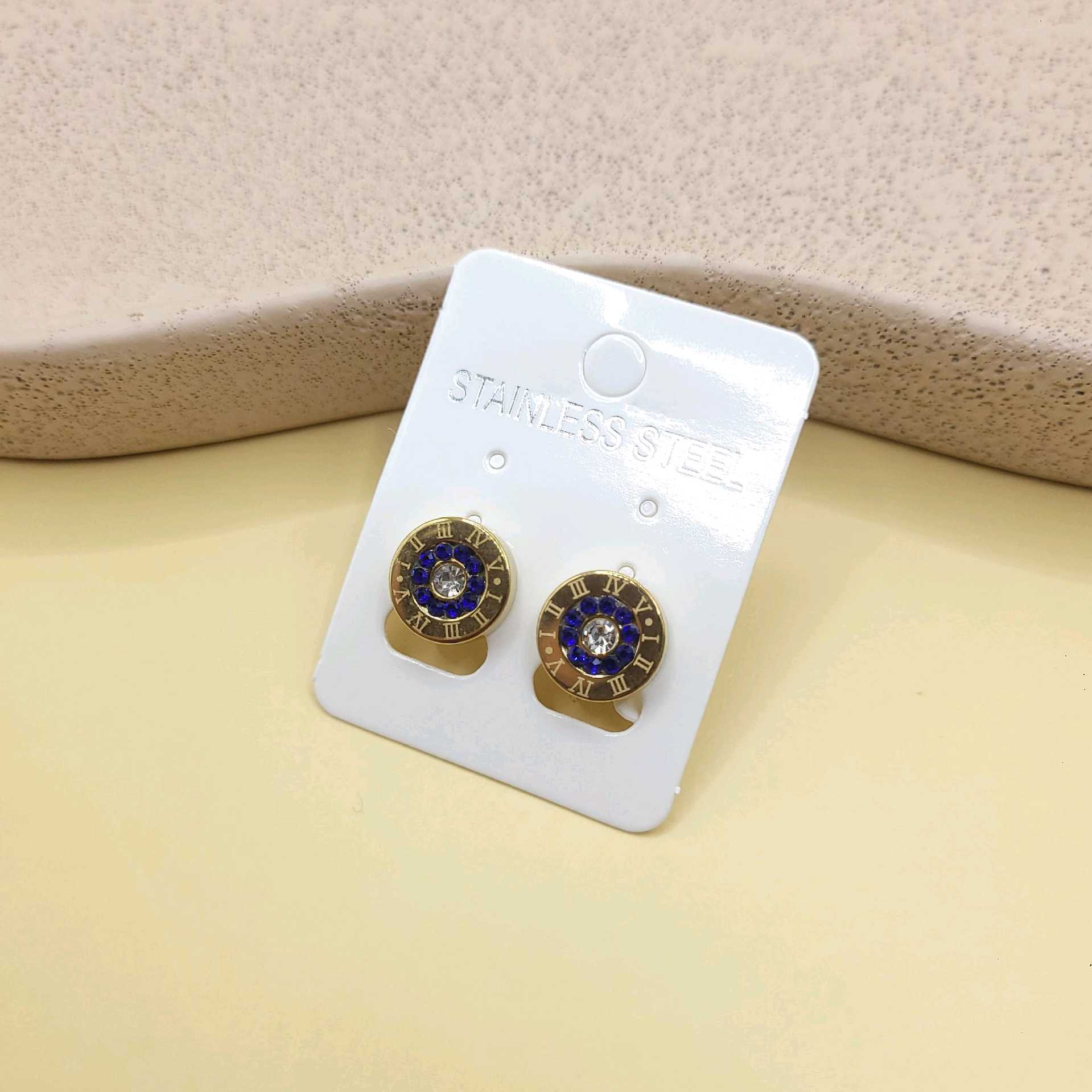 Aretes tipo Bvlgari piedras azul marino / acero inoxidable 