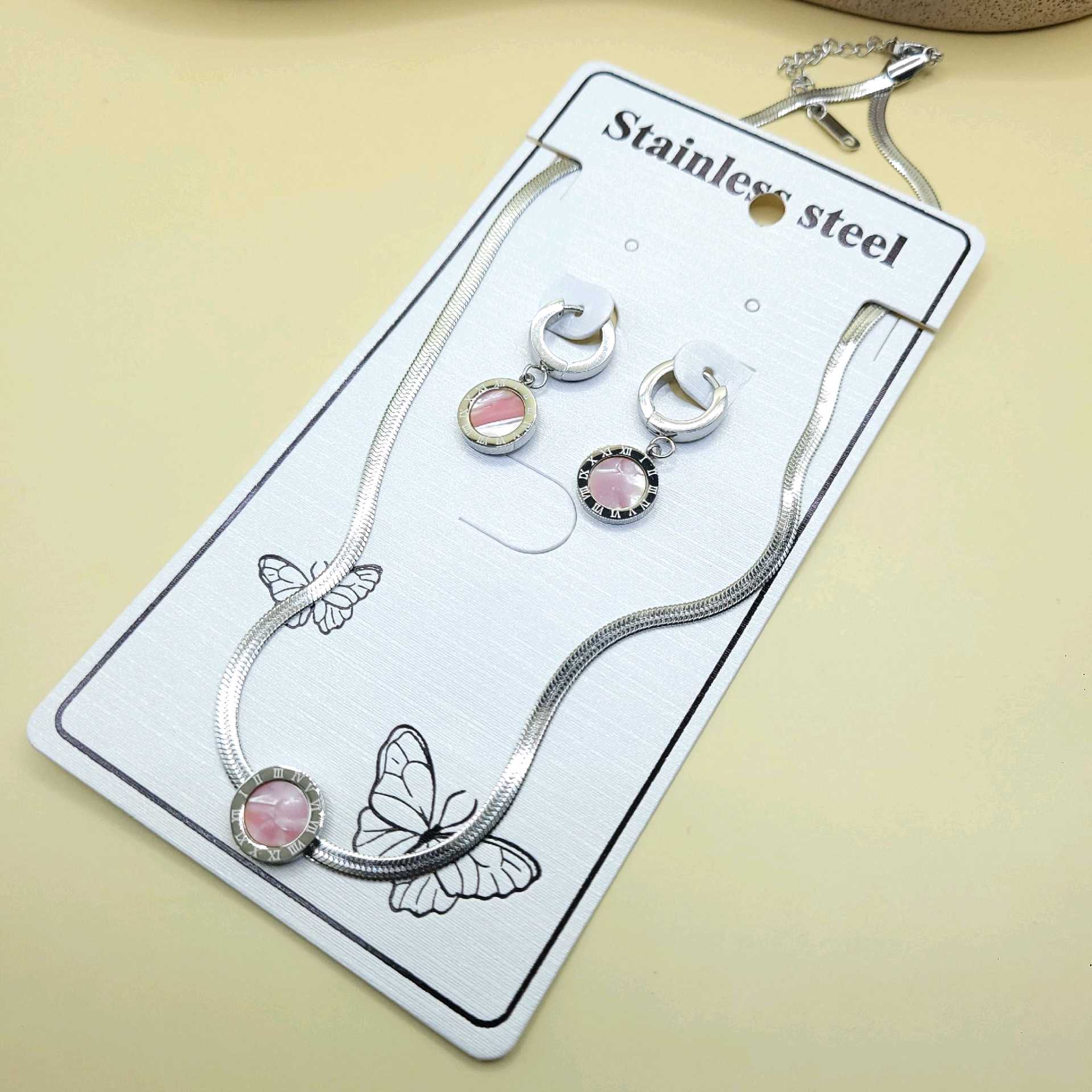 Juego dijes Bvlgari rosa / acero inoxidable 