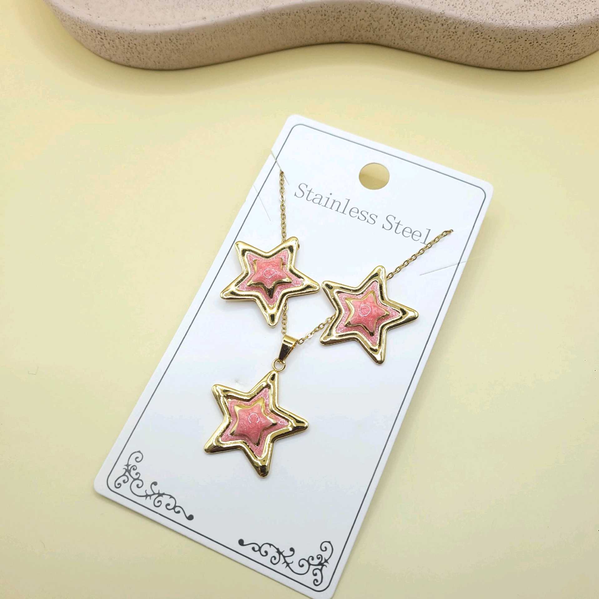 Juego estrellas esmaltado rosa / acero inoxidable