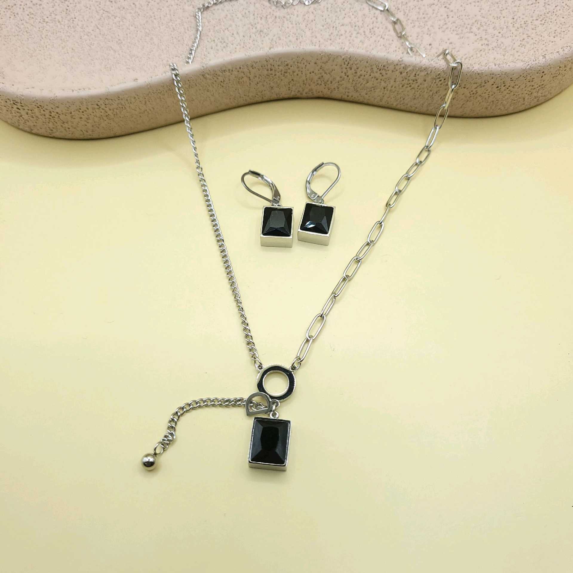 Juego tono plata piedras negras y colguije / acero inoxidable 
